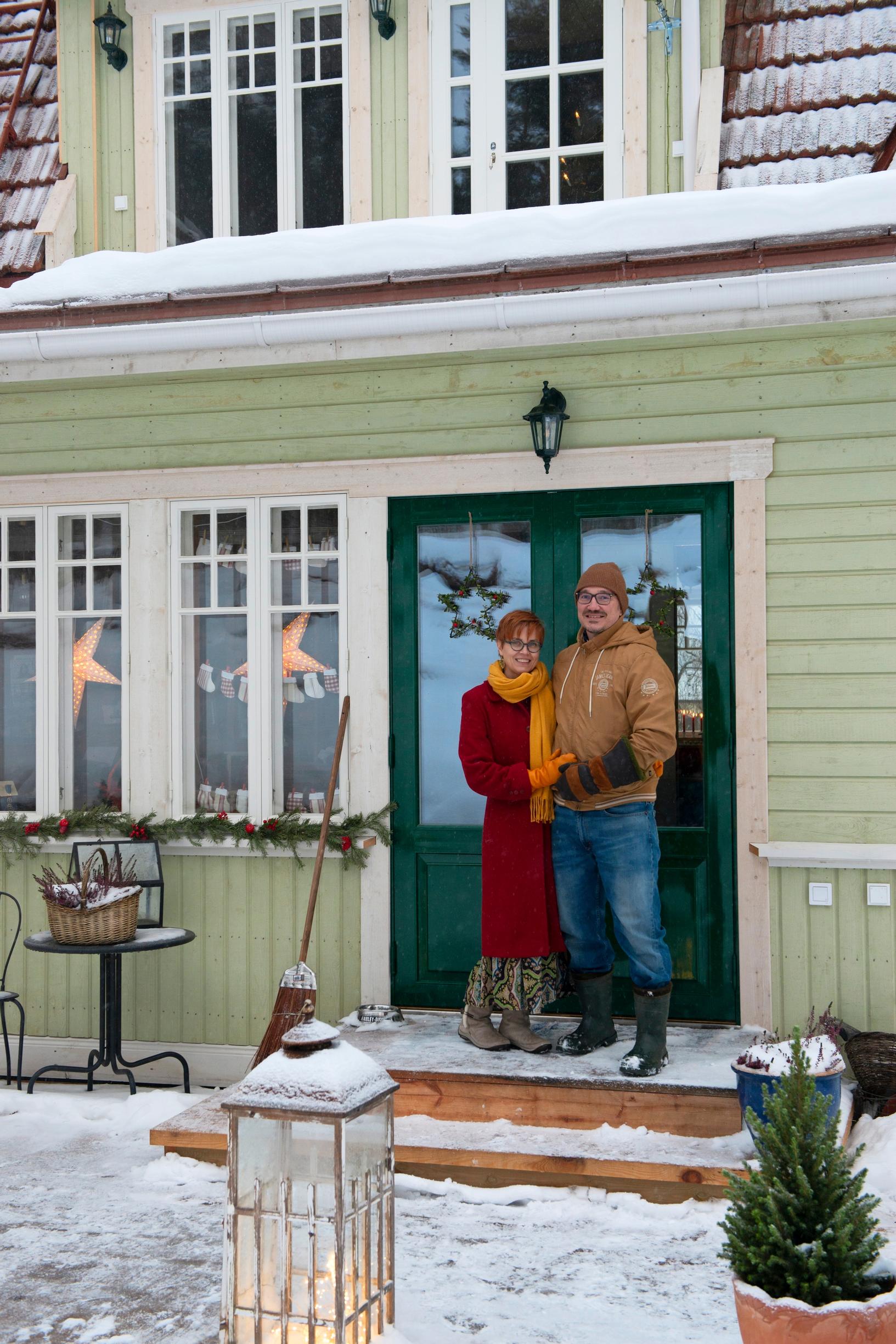 Satu and Jarmo at their front door.