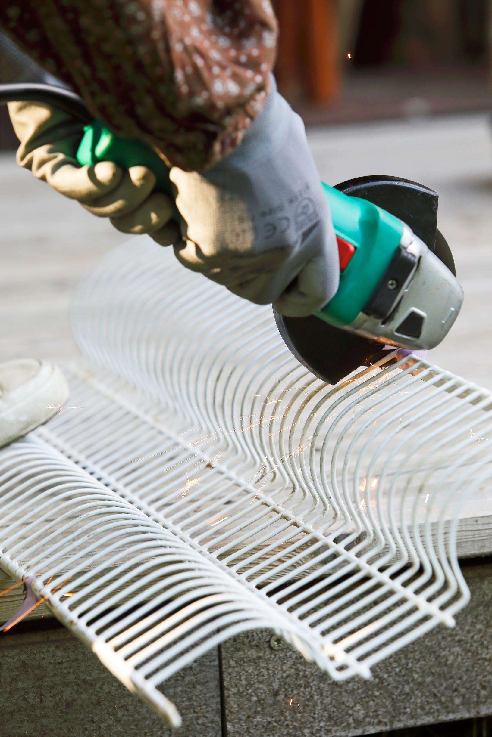 Shortening the metal dish shelf with an angle grinder