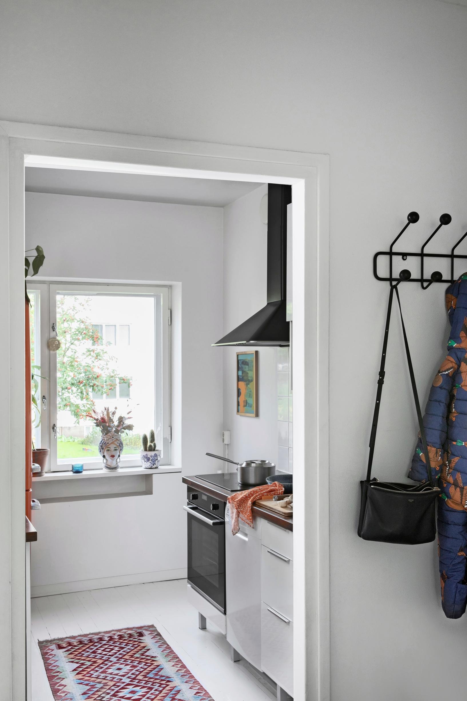 white kitchen and black range hood