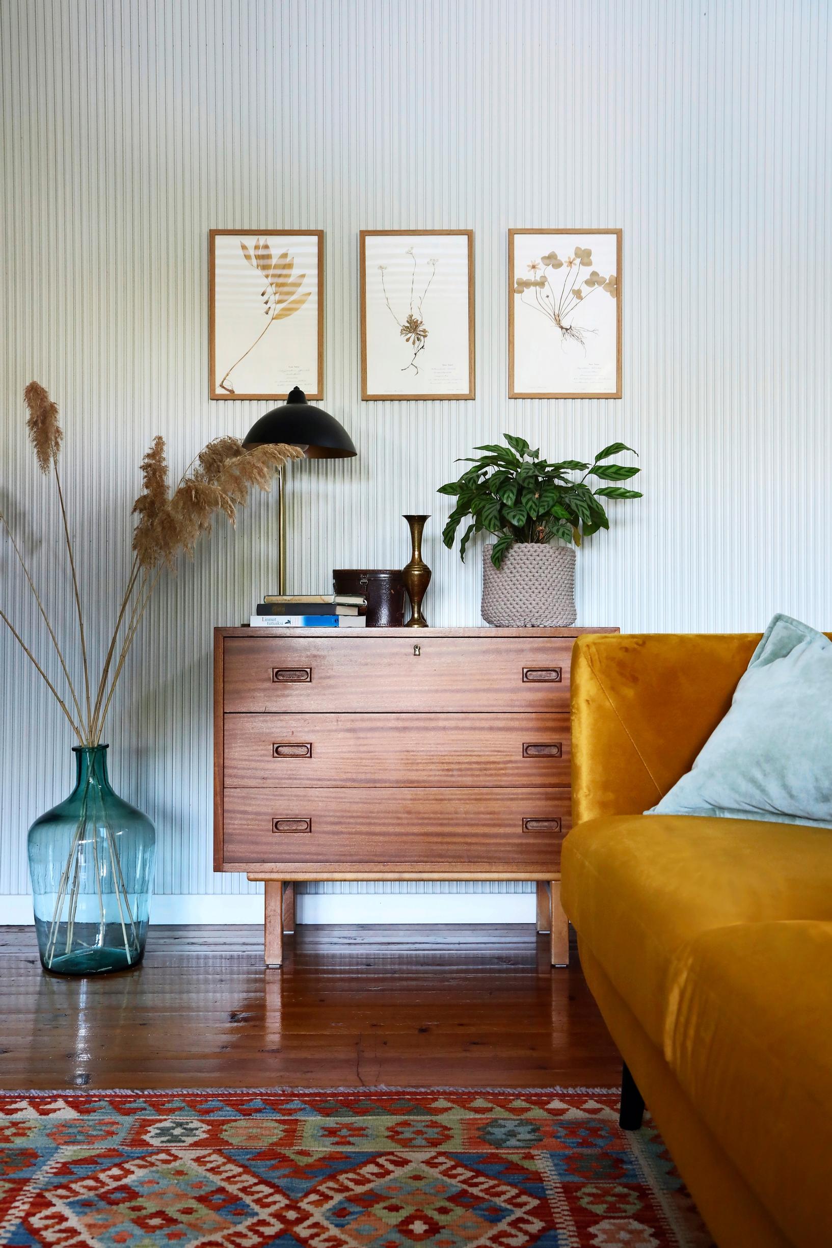 A 1950s dresser and a yellow sofa