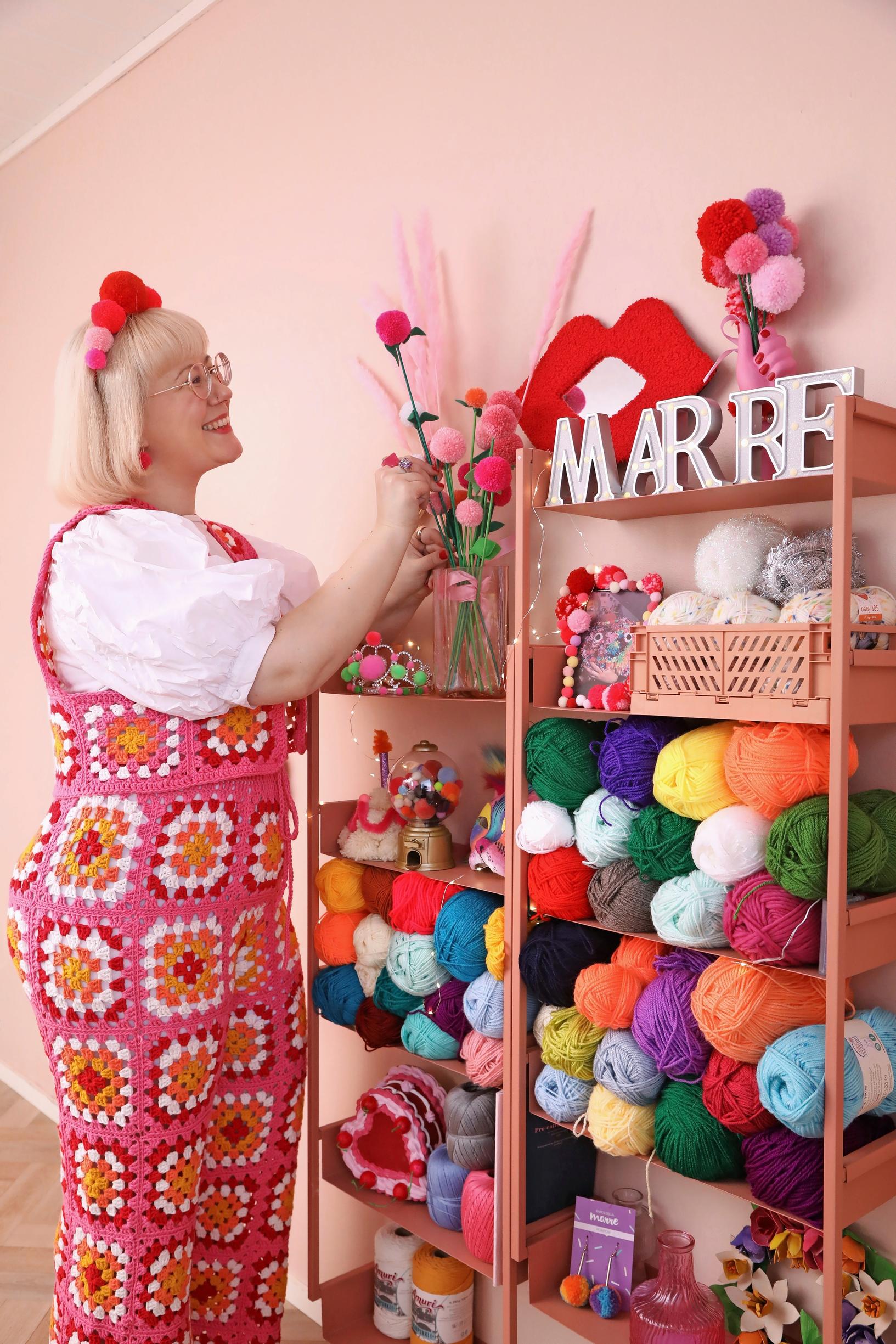 Mari wearing an outfit made of granny squares.