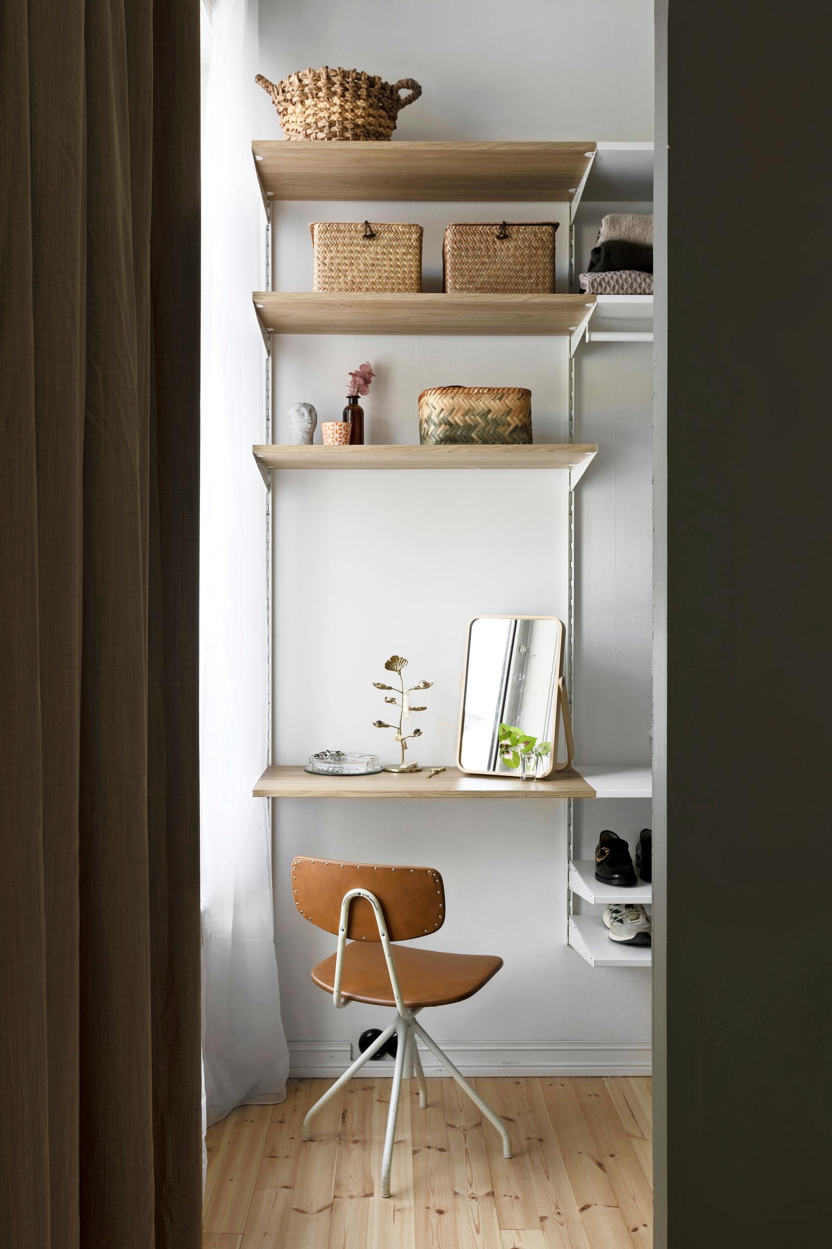 Louise’s makeup table built into a shelving system