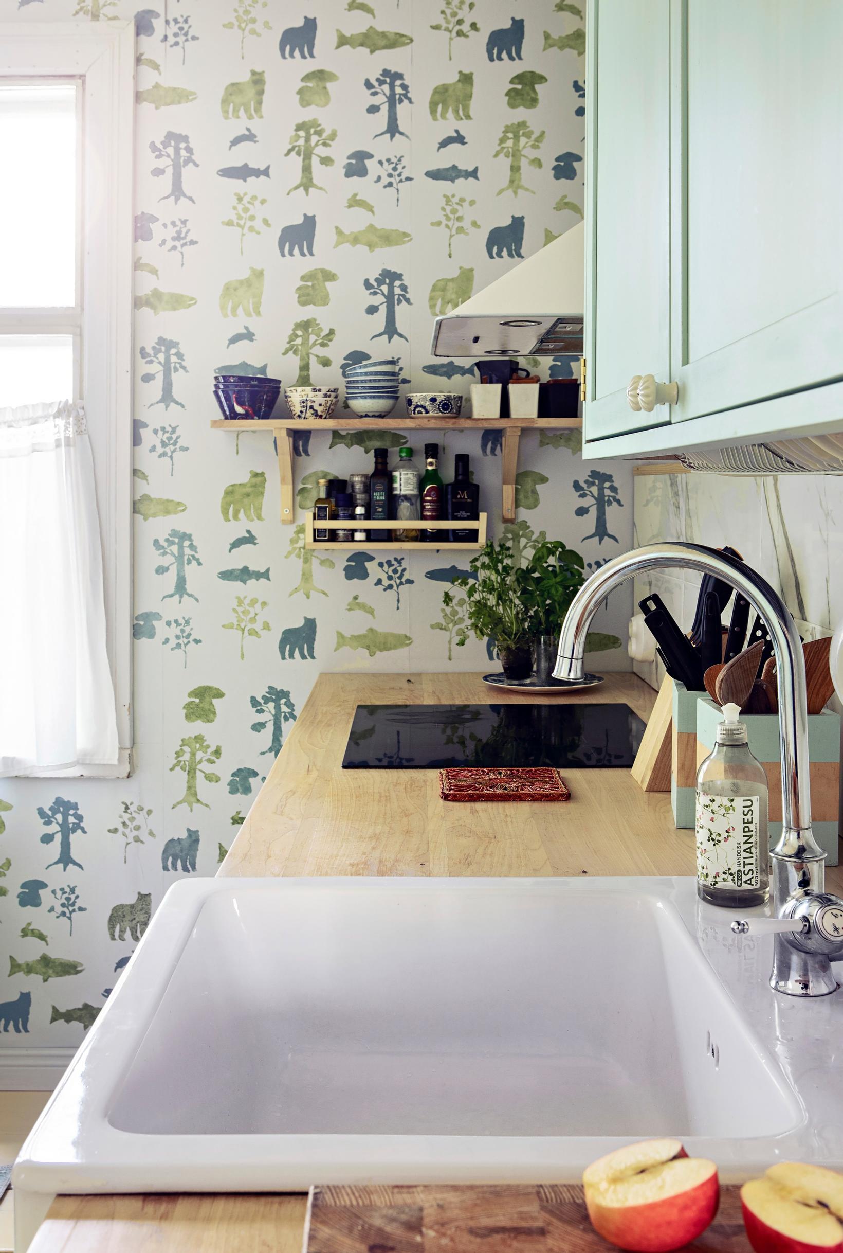 Birch countertop and IKEA porcelain sink in the kitchen