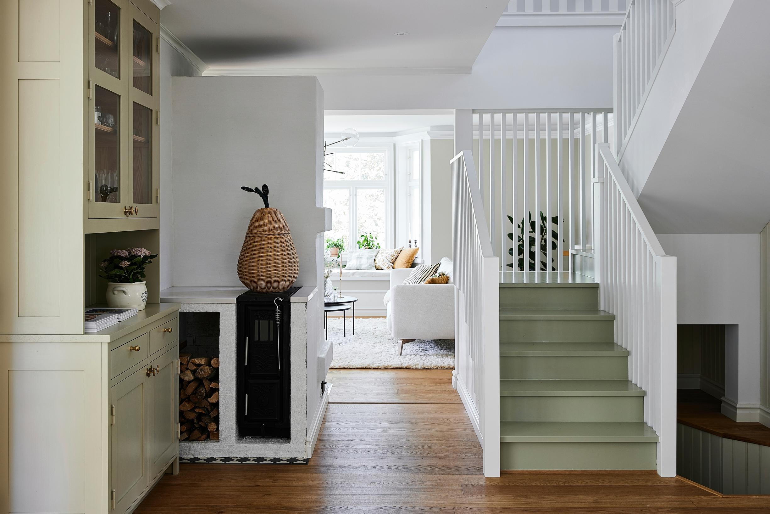 Interior staircase painted green in the entry hall