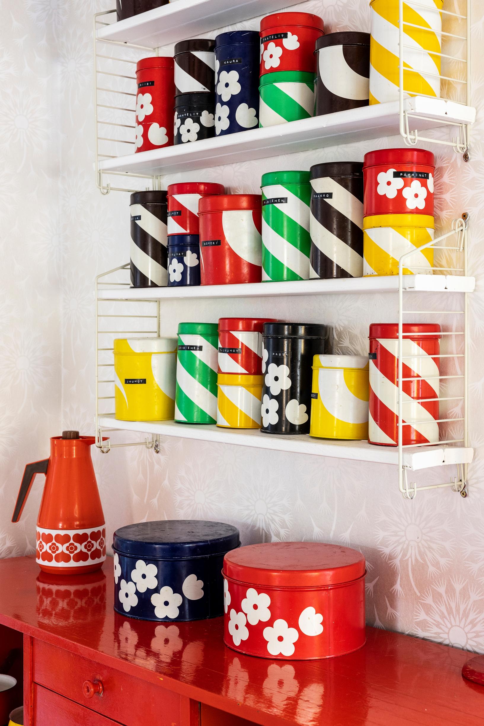 An Aarikka tin collection and DIY string-style shelves.