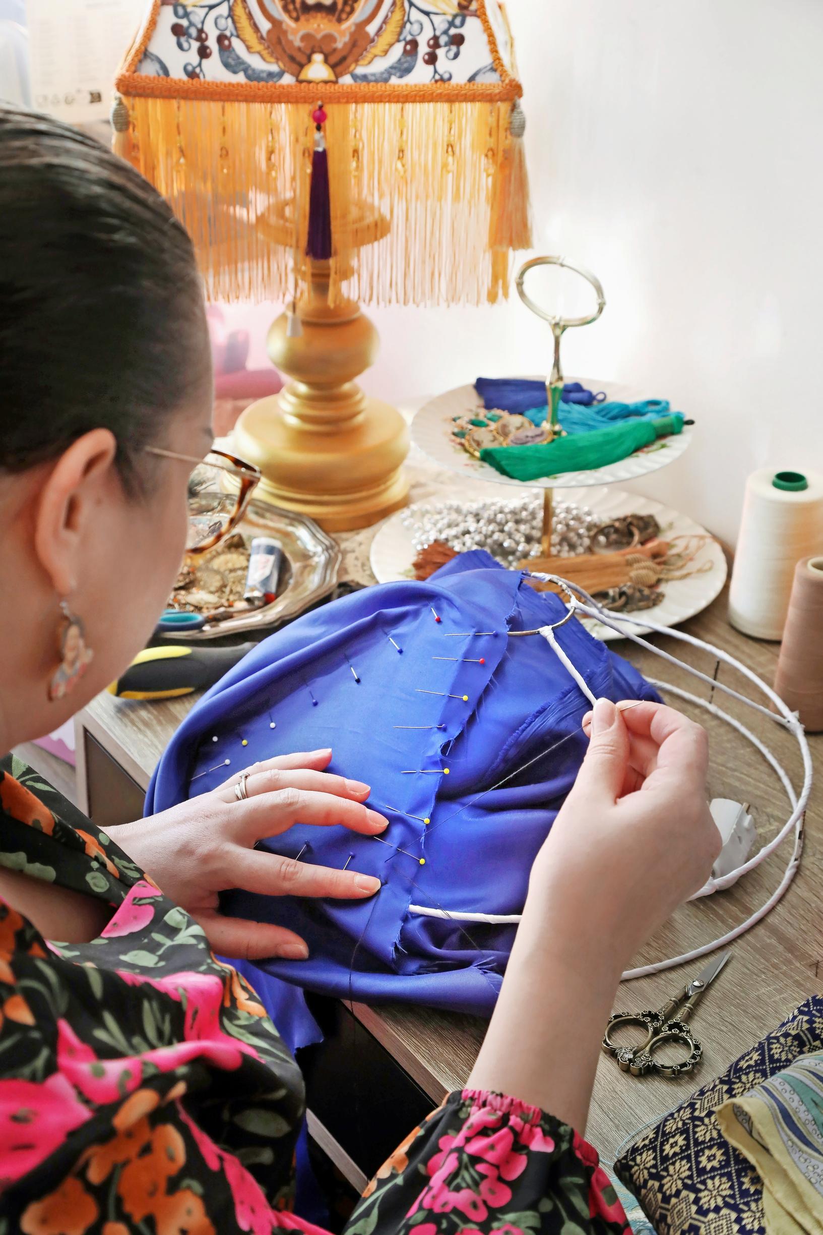Janni sewing by hand.