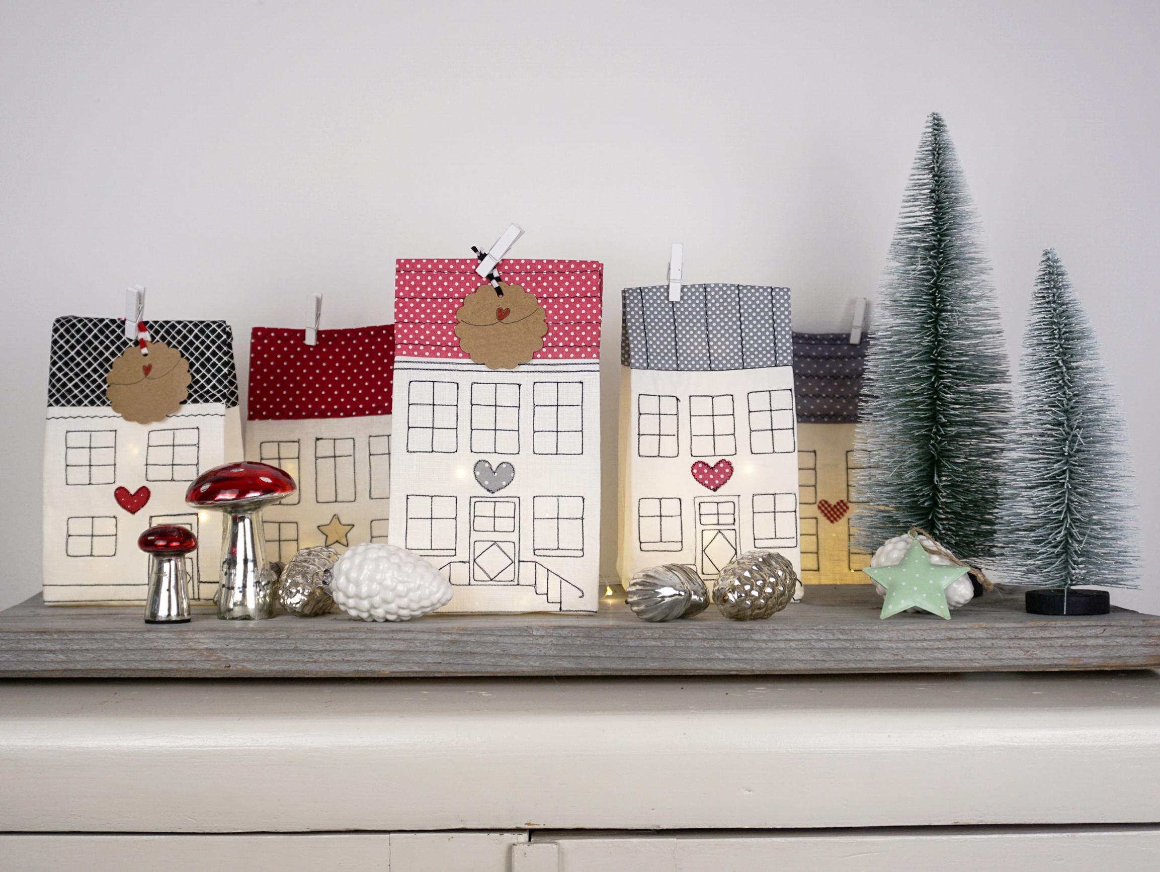 Different-sized light-up houses