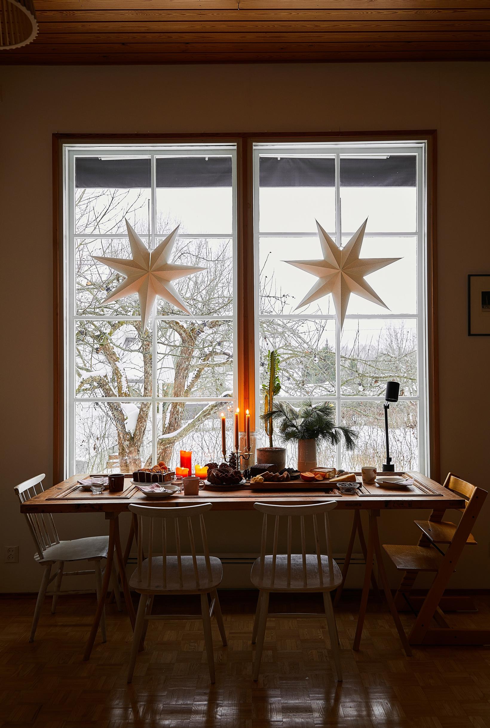 The dining table sits by the window.