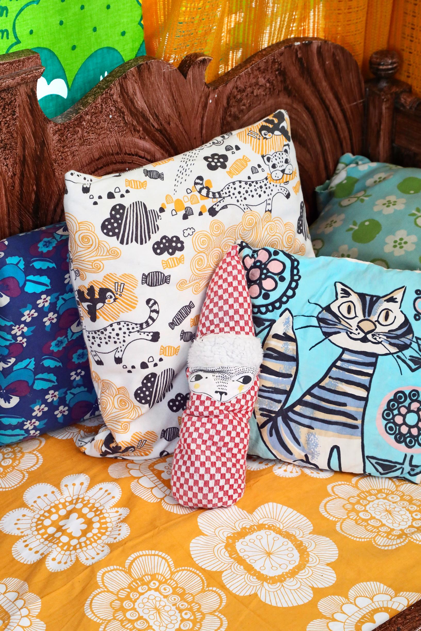 Throw pillows in the children’s room featuring patterns designed by Leena Rissa.