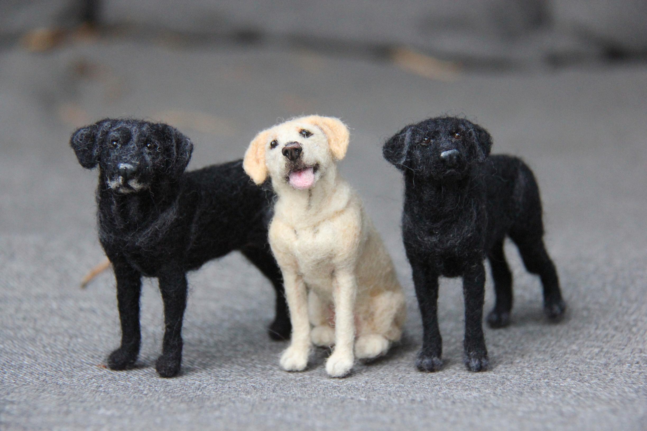 Three felted dogs.