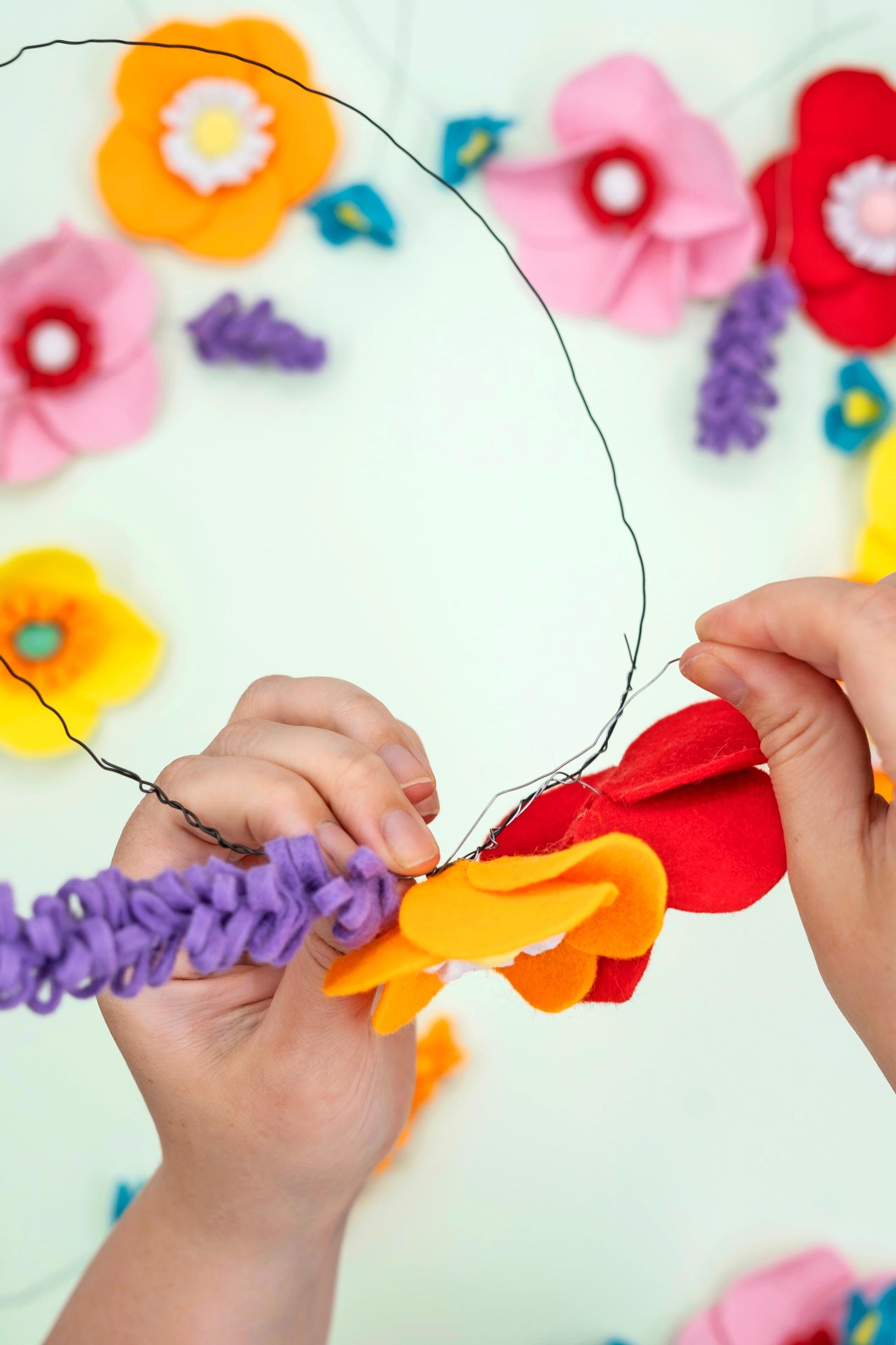 Attach the elements to a wire wreath base.