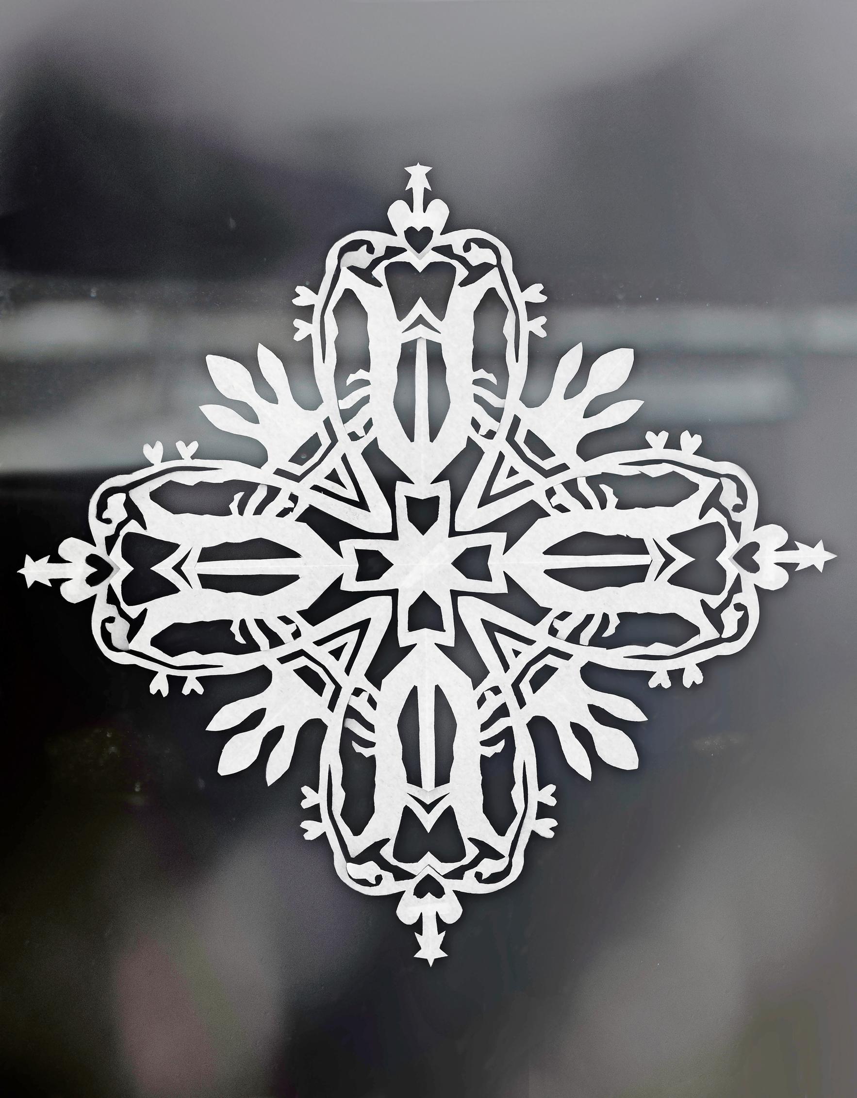 Snowflake ornament in the window.