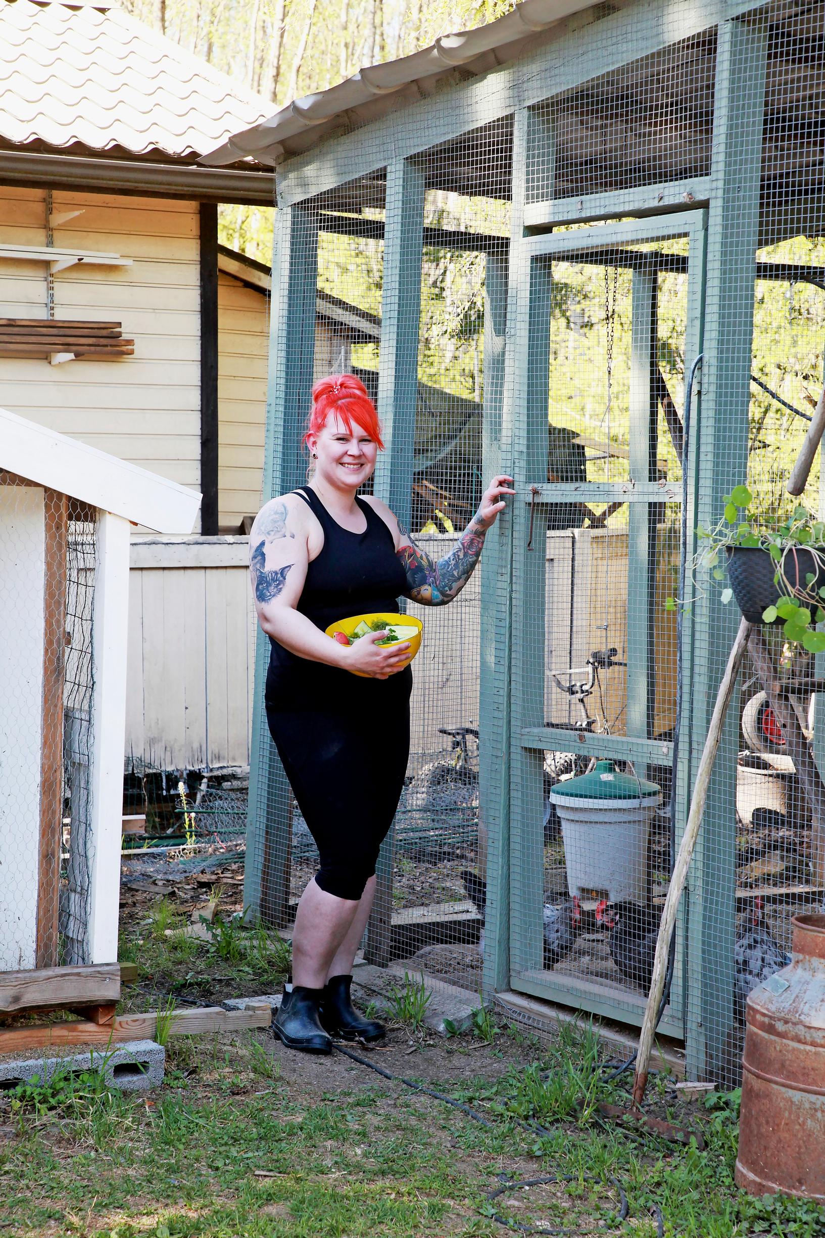 Anna-Kaisa in front of her chicken coop.