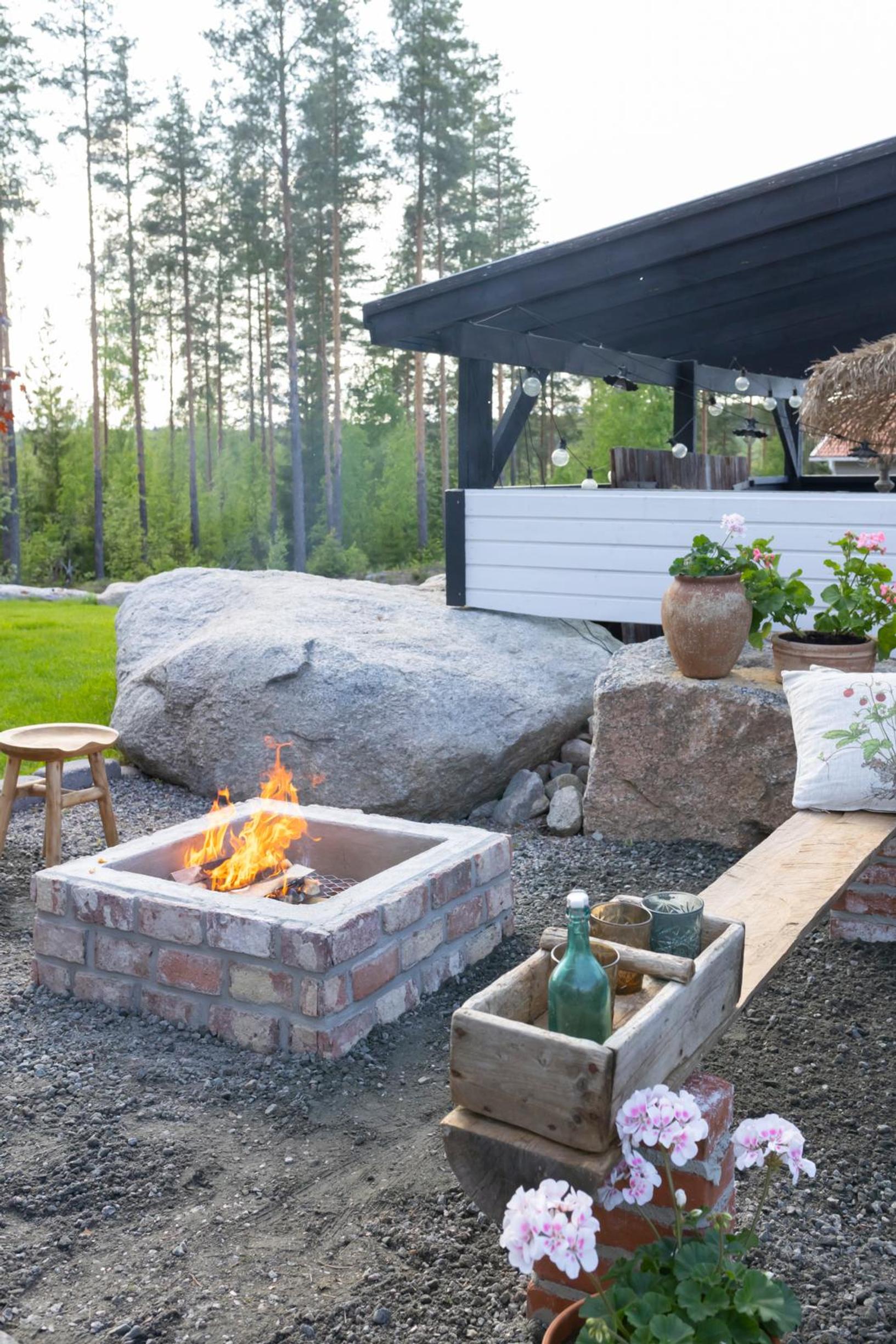 A square fire pit built from recycled materials