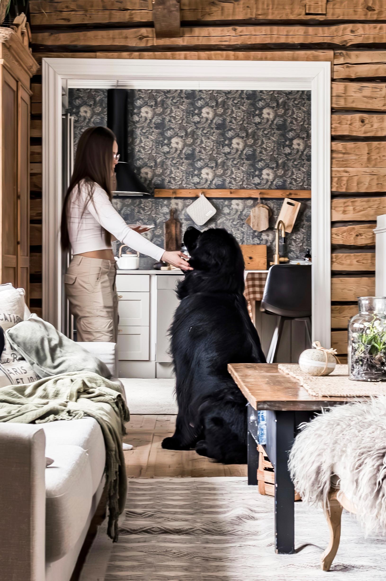 Lotta and the dog standing in a doorway