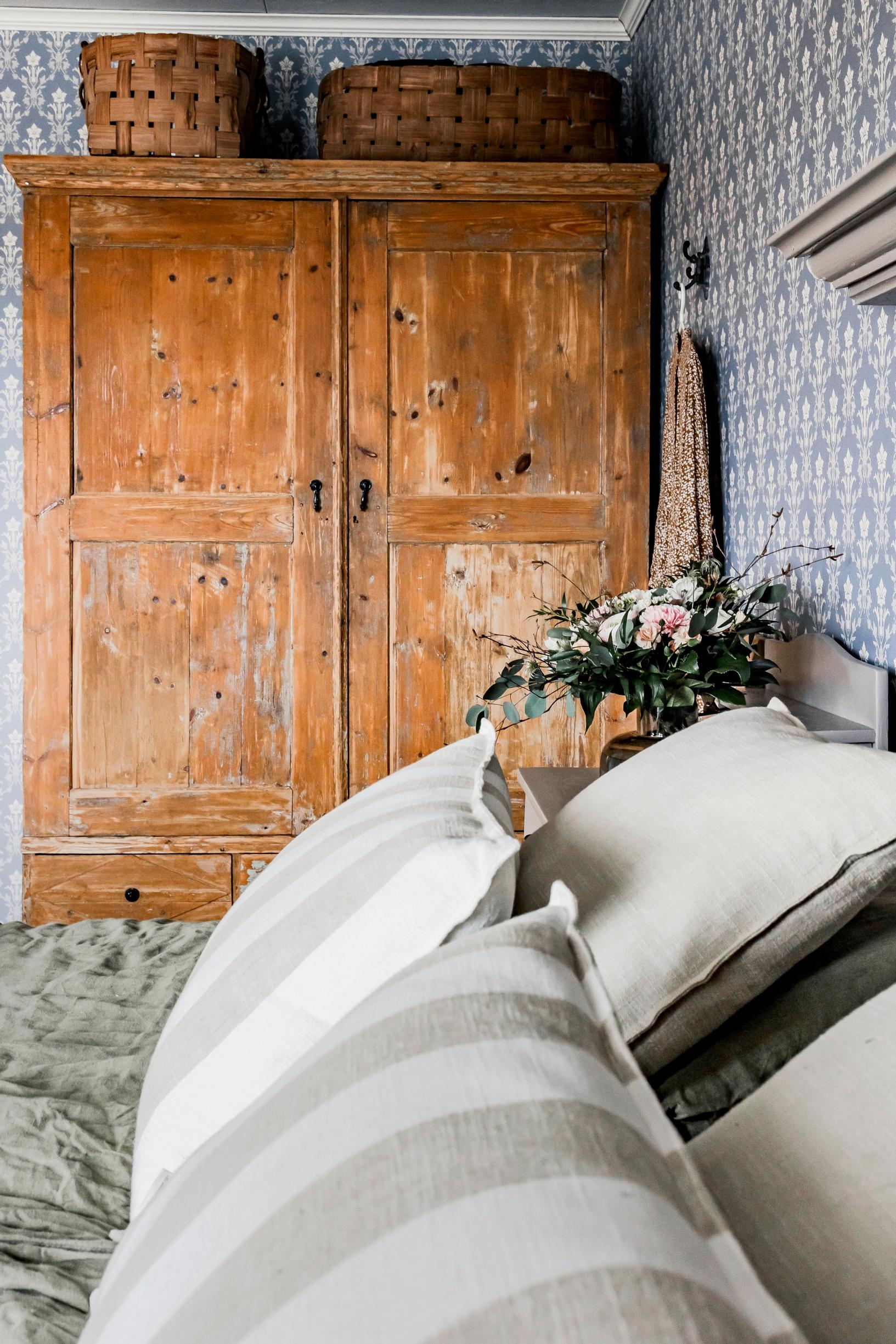 a headboard and an old cabinet