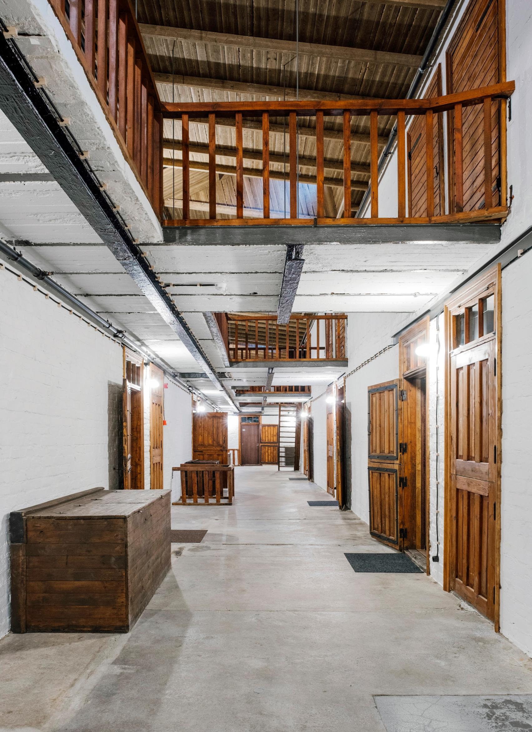 The two-story lobby of the old horse stable