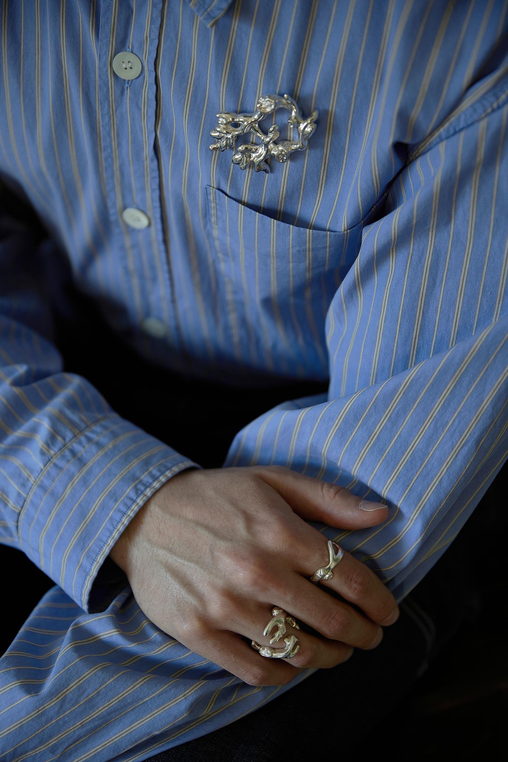 Rings in the hands of the jewelry designer.