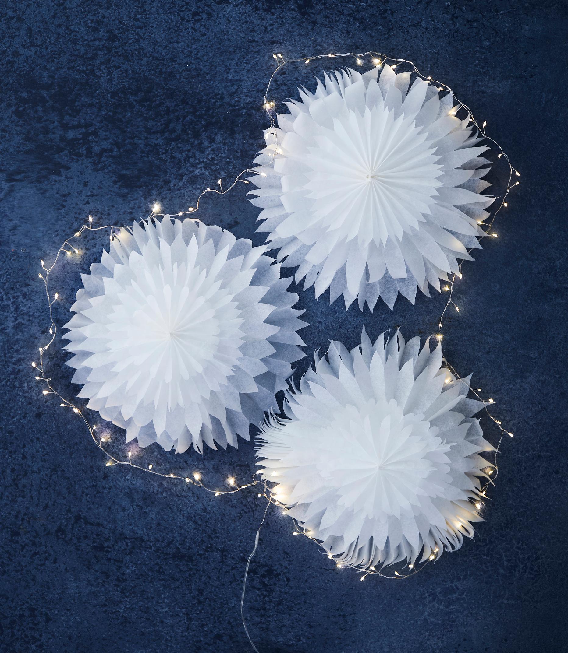 Bring a winter wonderland into your home—DIY snow flowers using baking paper
