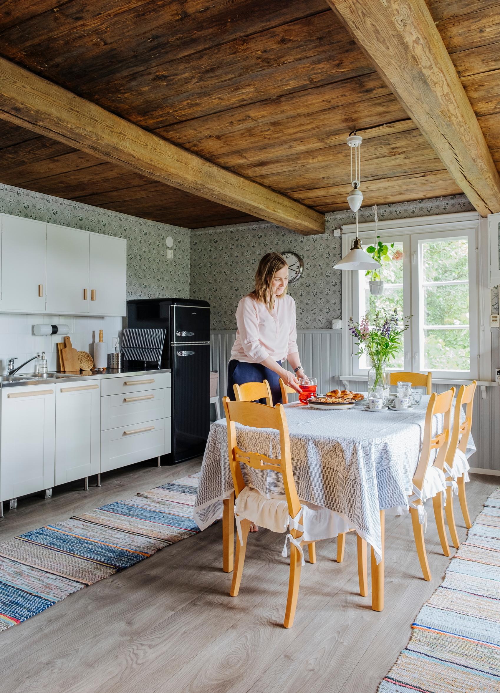 Sanna sets the table in the living area