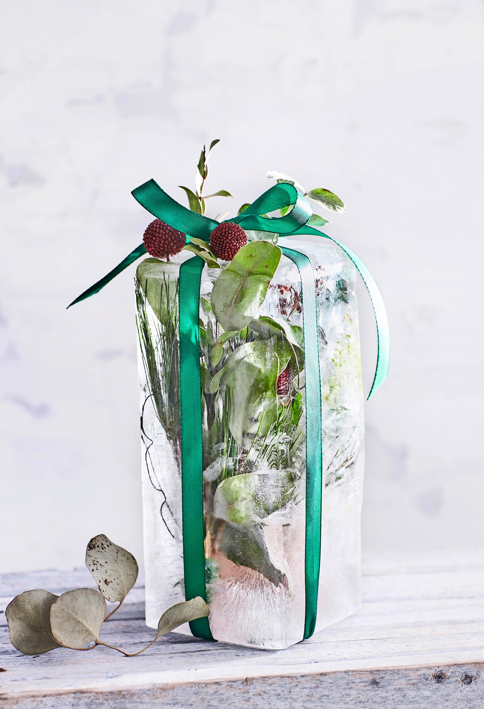 An ice lantern made in a milk carton