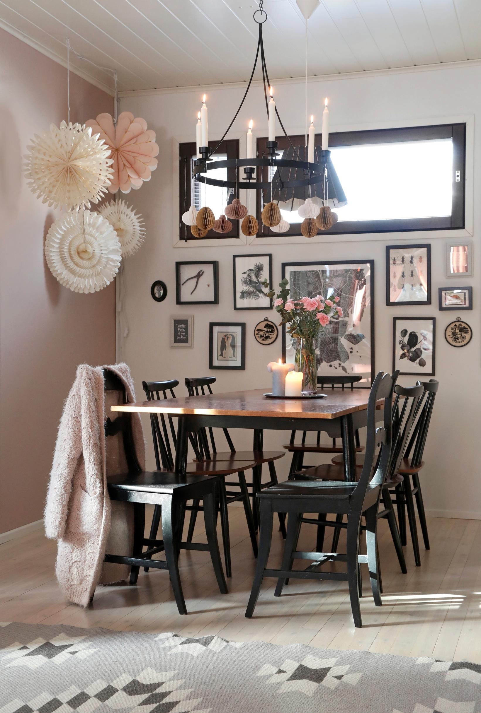 A black dining set and a wall collage