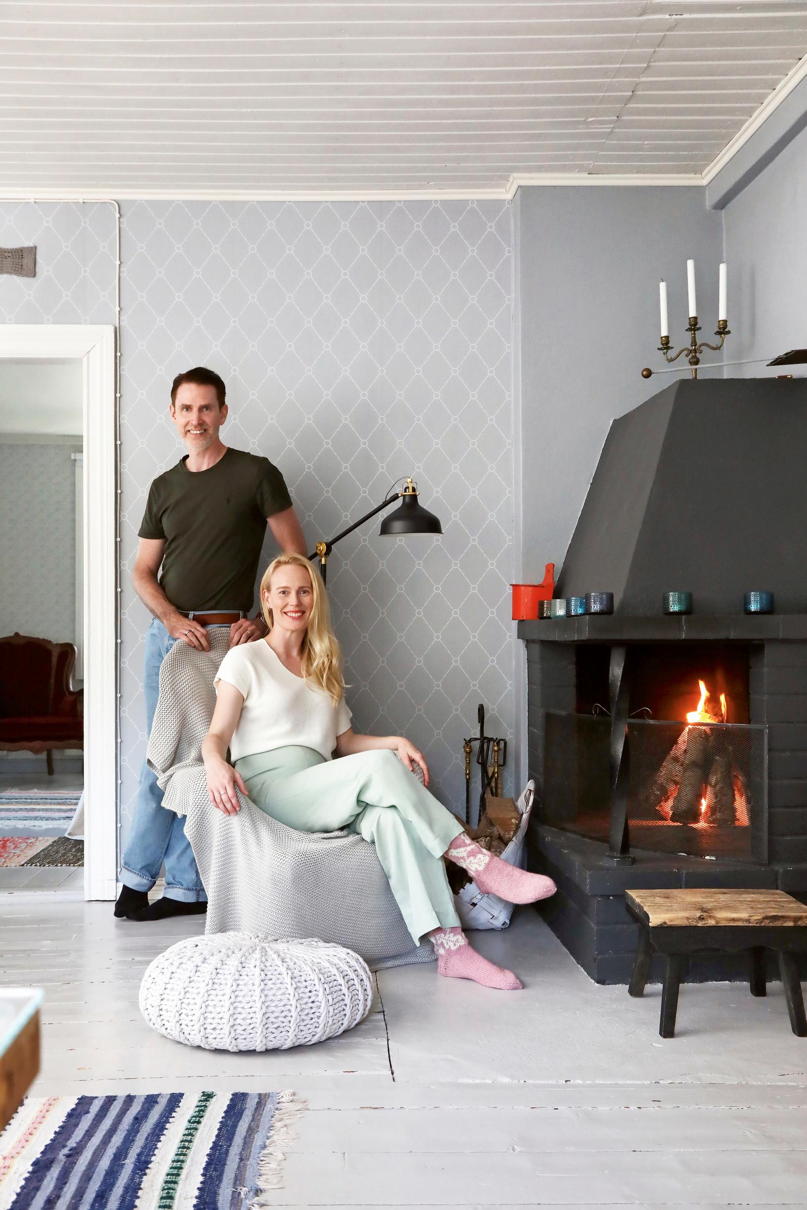 Sami and Jutta Helenius by the fireplace
