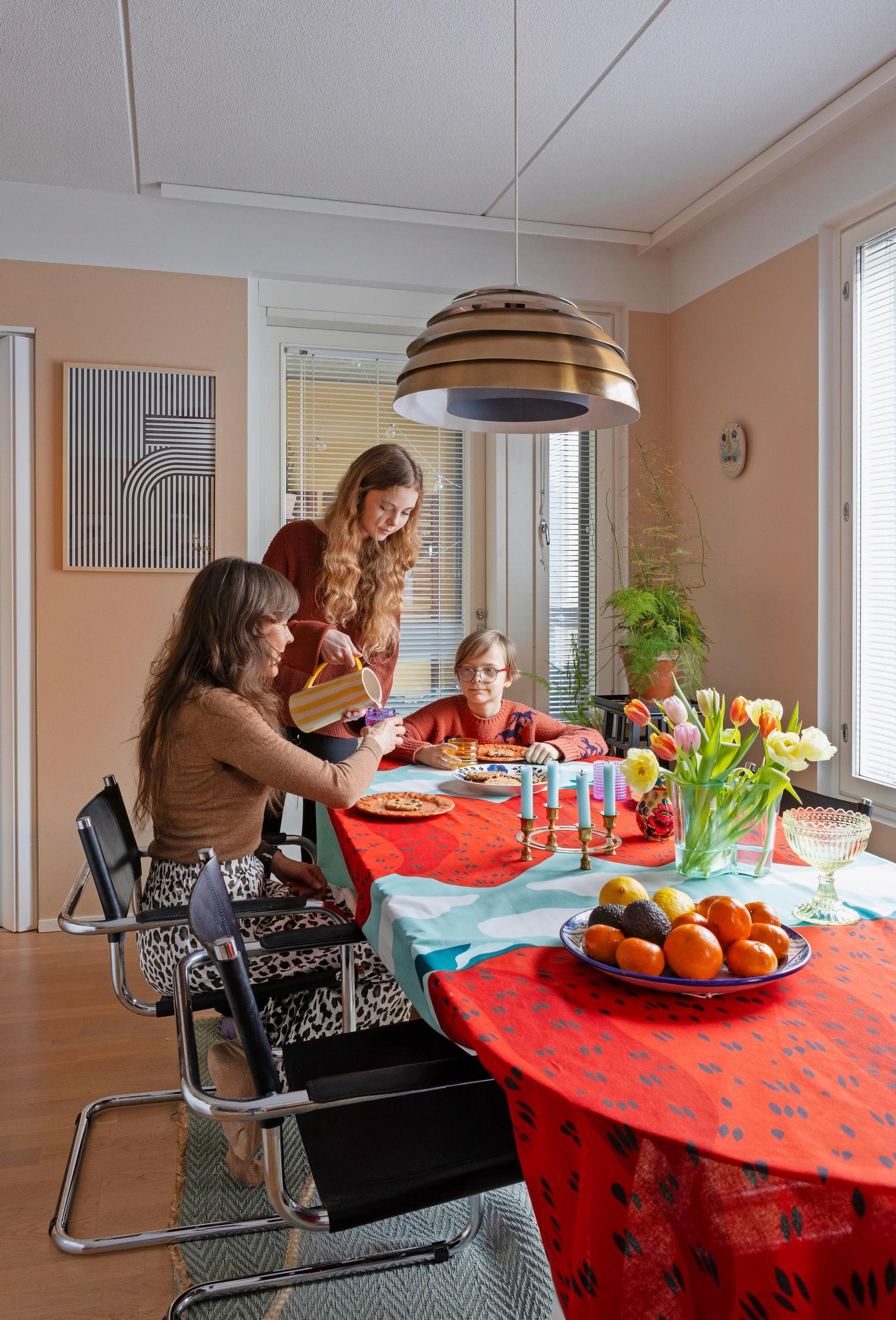 Photo of the family around the dining table.