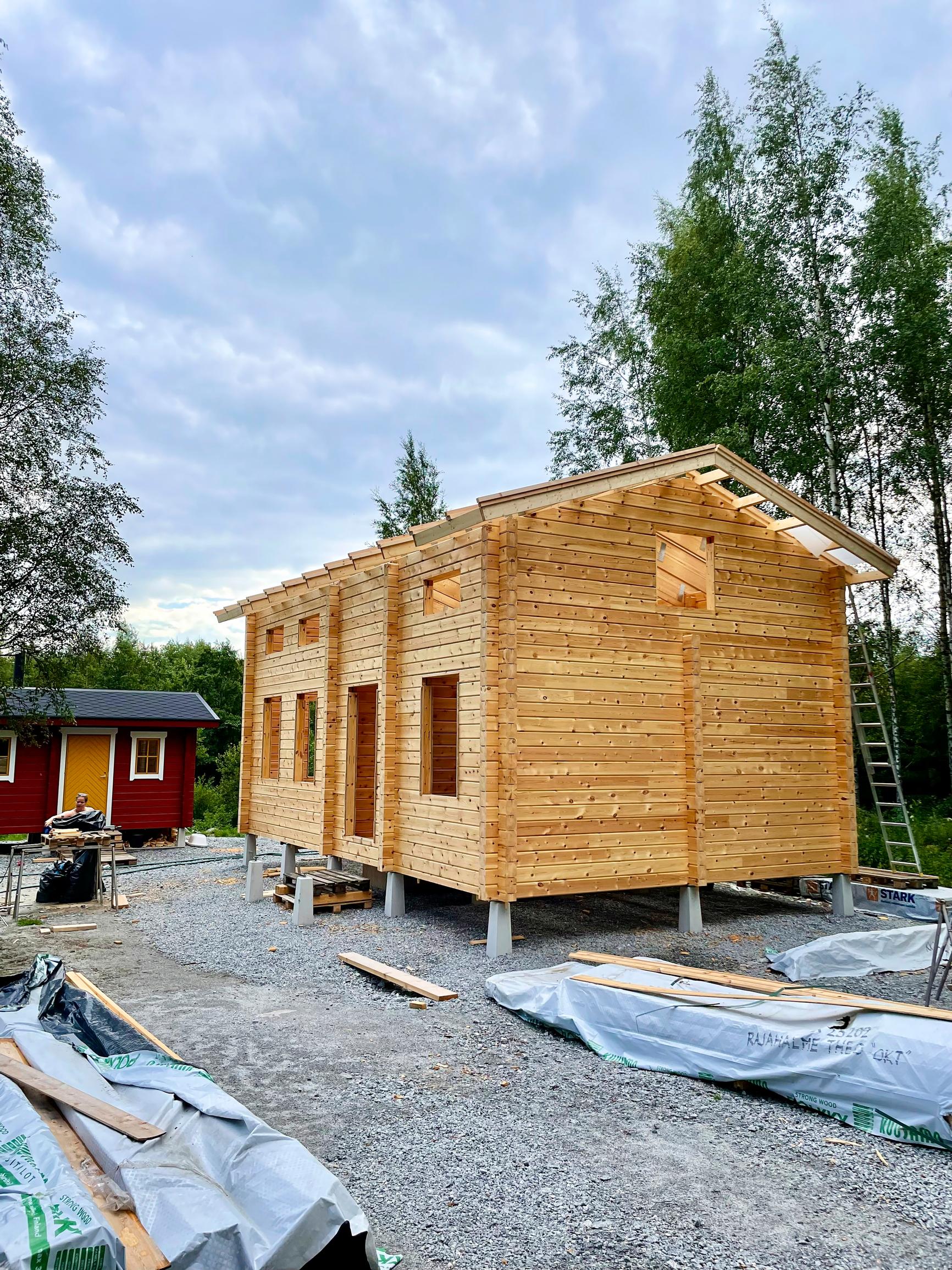The log house is nearly built