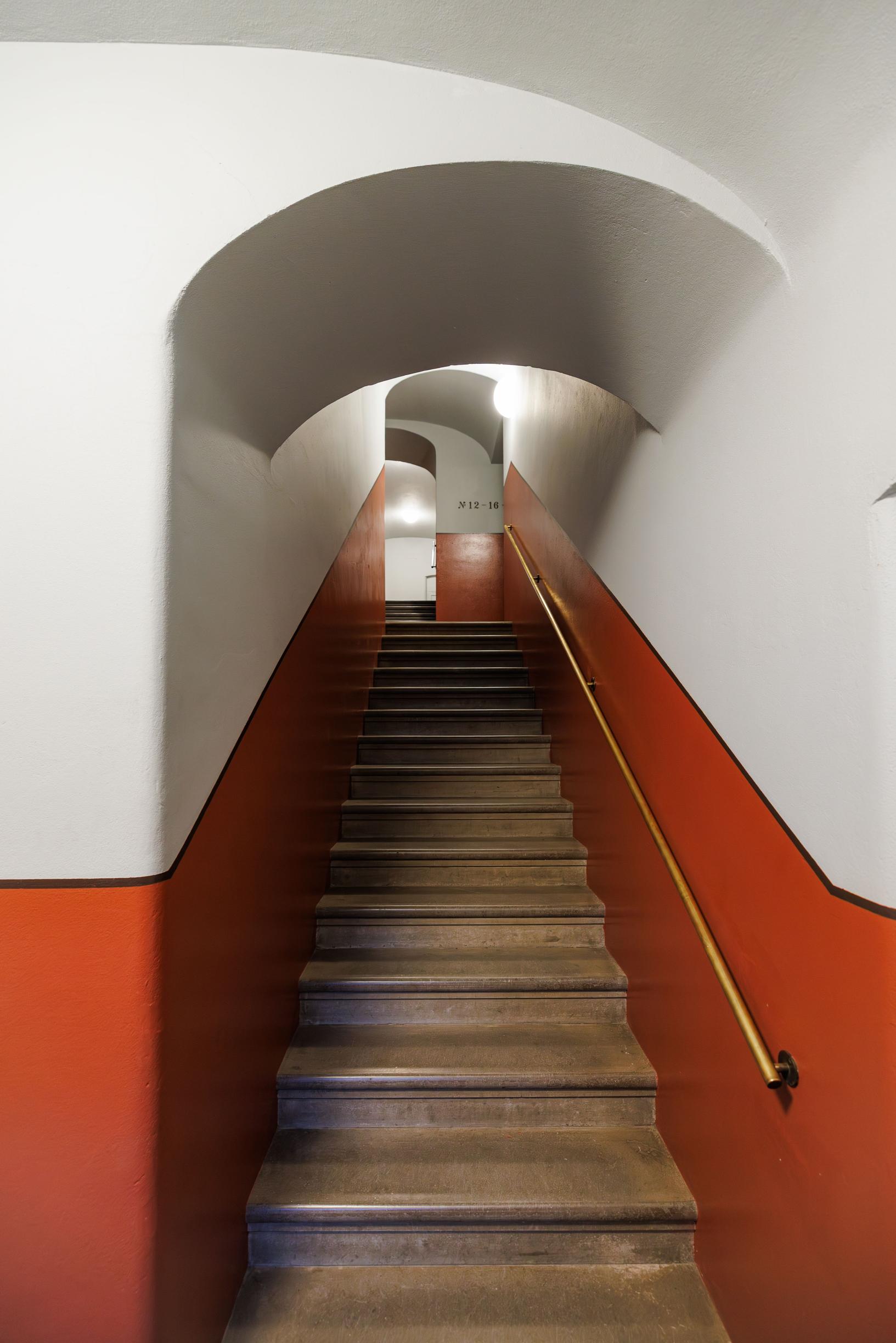 a stairwell painted orange