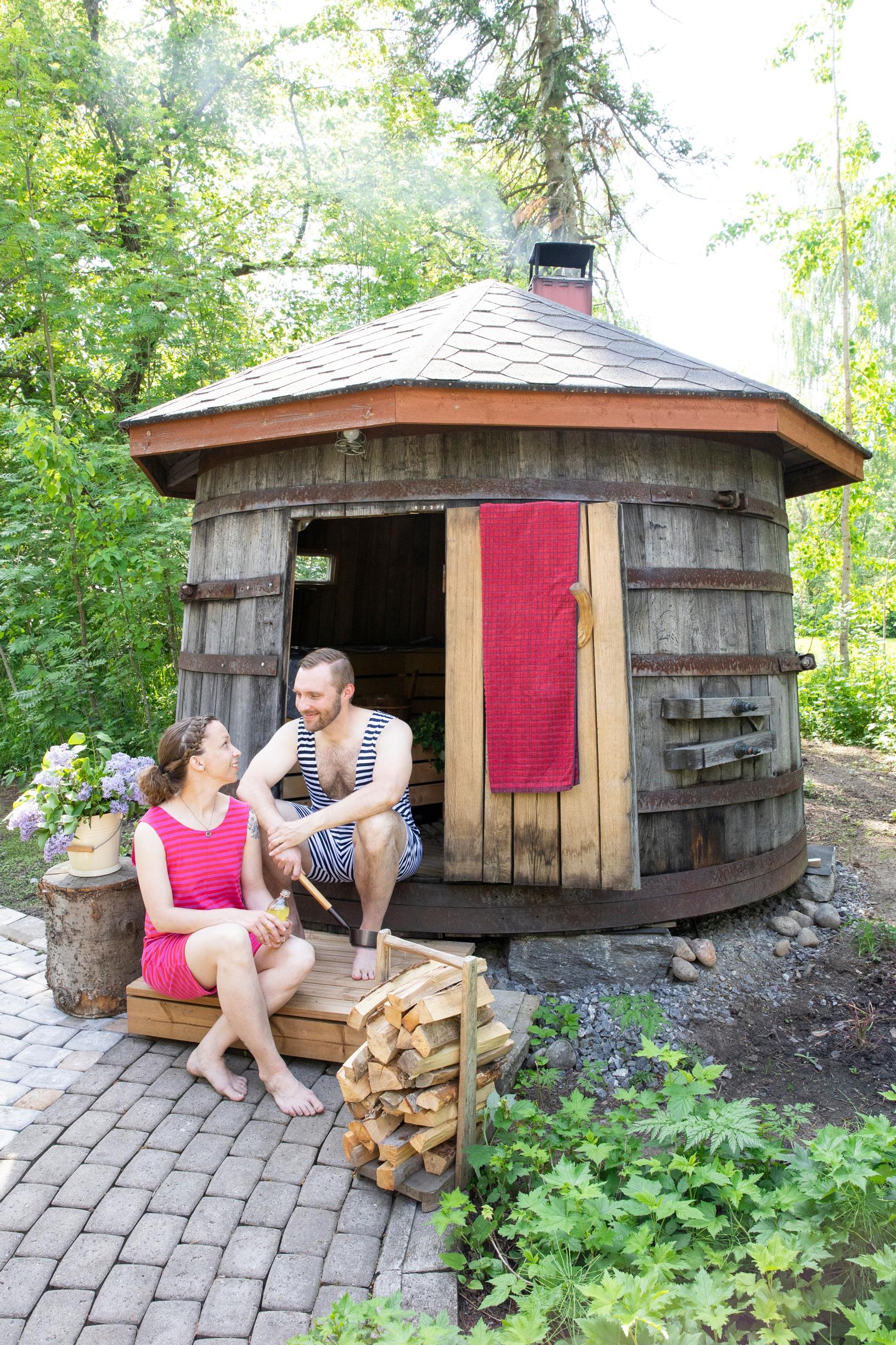On the steps of the whiskey barrel sauna