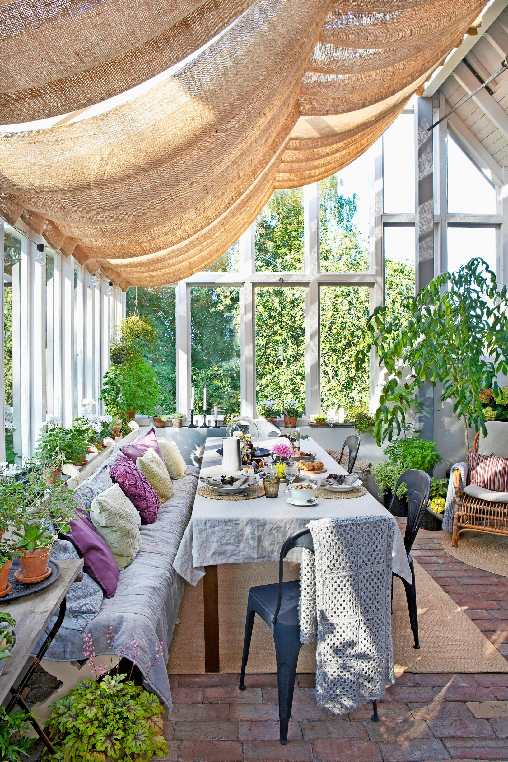 A 30-square-meter uninsulated glasshouse largely built from reclaimed materials