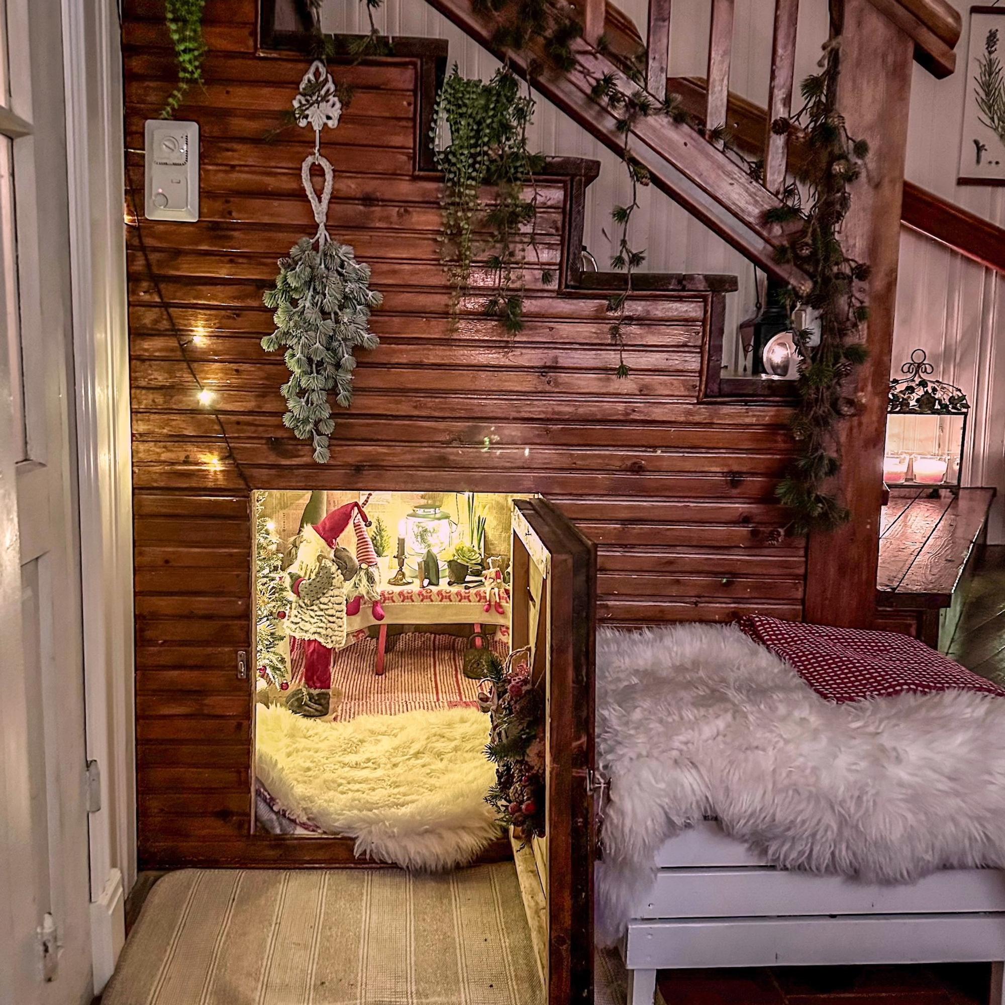 Peek in Minna’s cupboard under the stairs: “When you open the Christmas door, you can step right into an elf cottage!”