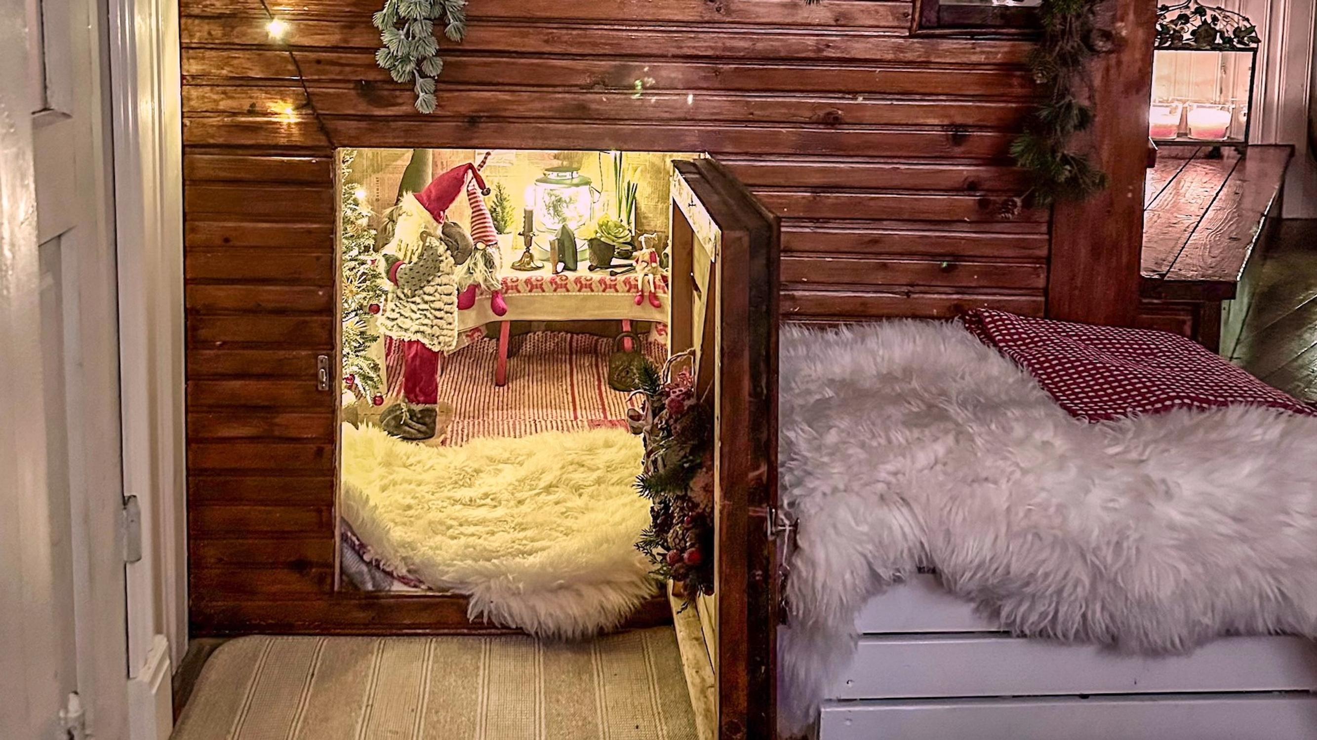 Peek in Minna’s cupboard under the stairs: “When you open the Christmas door, you can step right into an elf cottage!”
