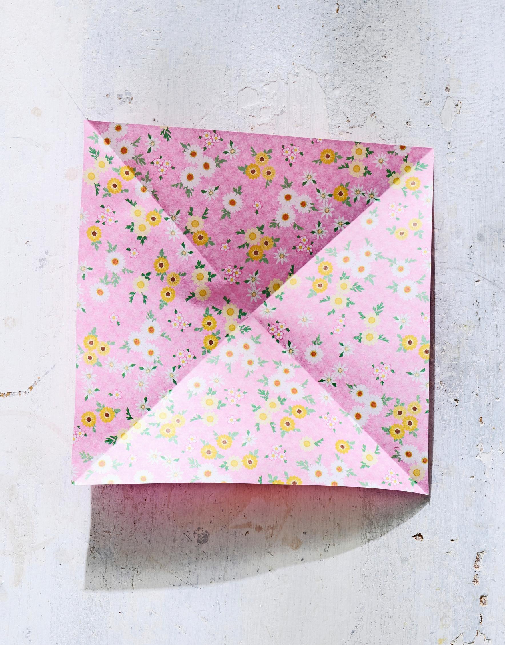 The square sheet of paper has been folded.