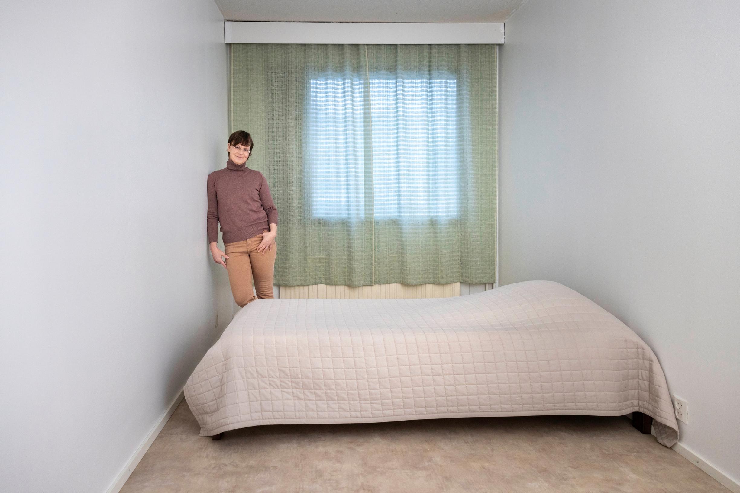 a bedroom with just a bed