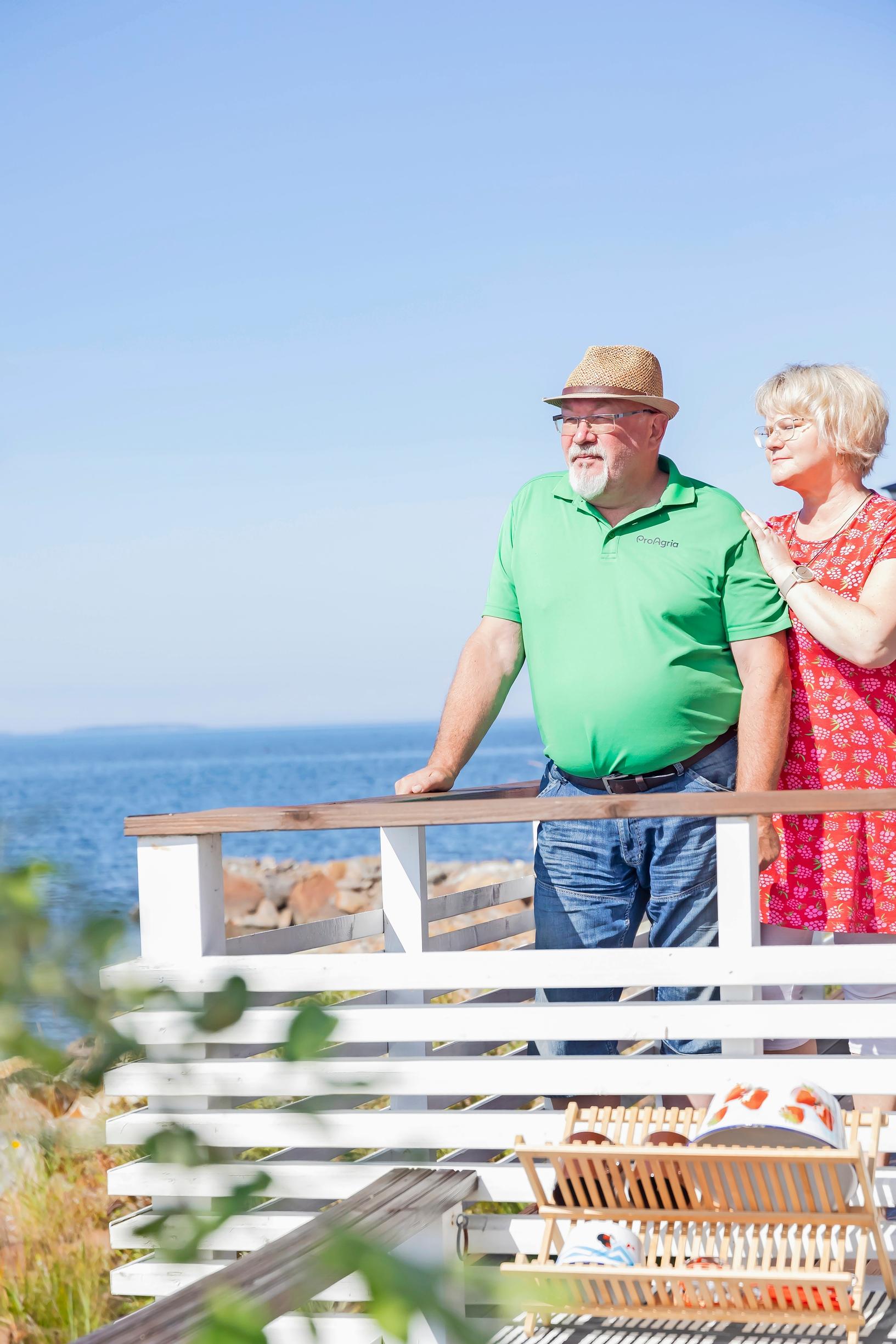 Jarmo and Seija Karhula on the cottage terrace by the Gulf of Bothnia