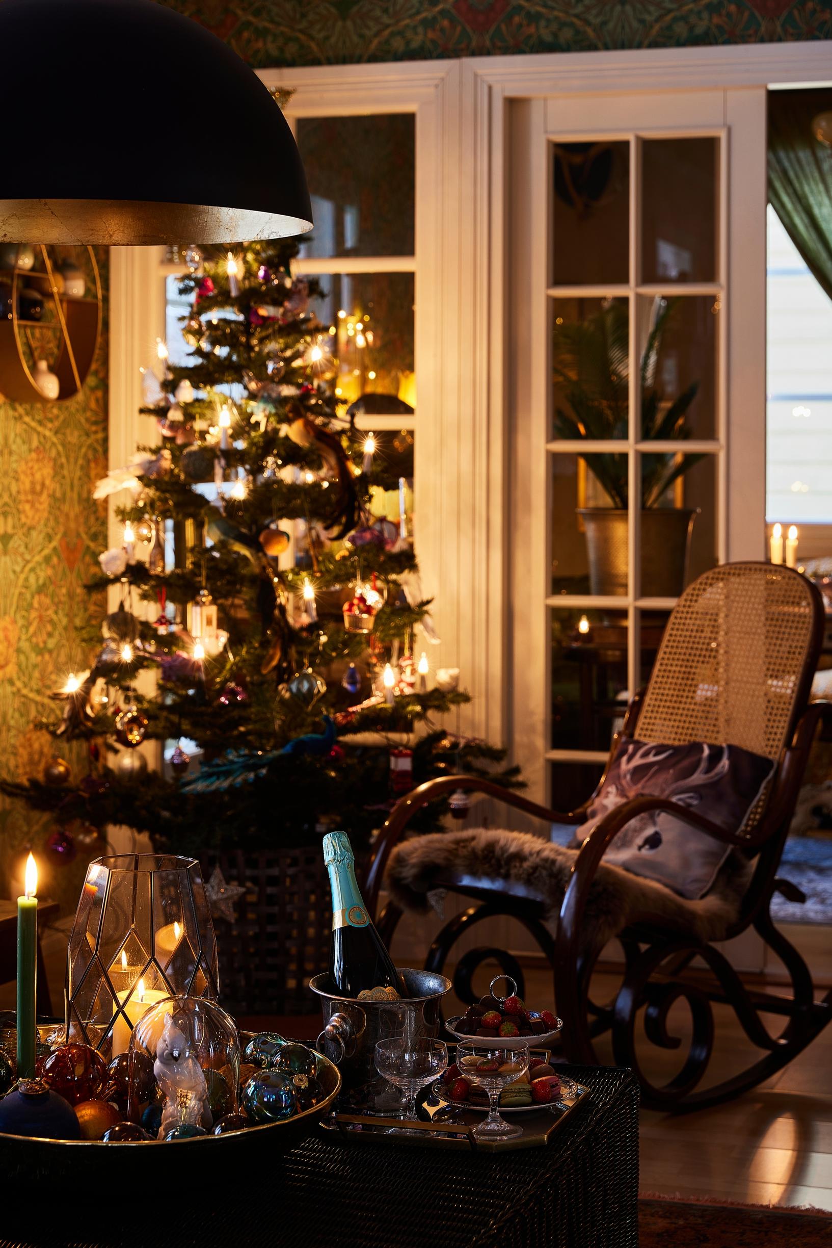 A decades-old artificial Christmas tree in a cozy living room.