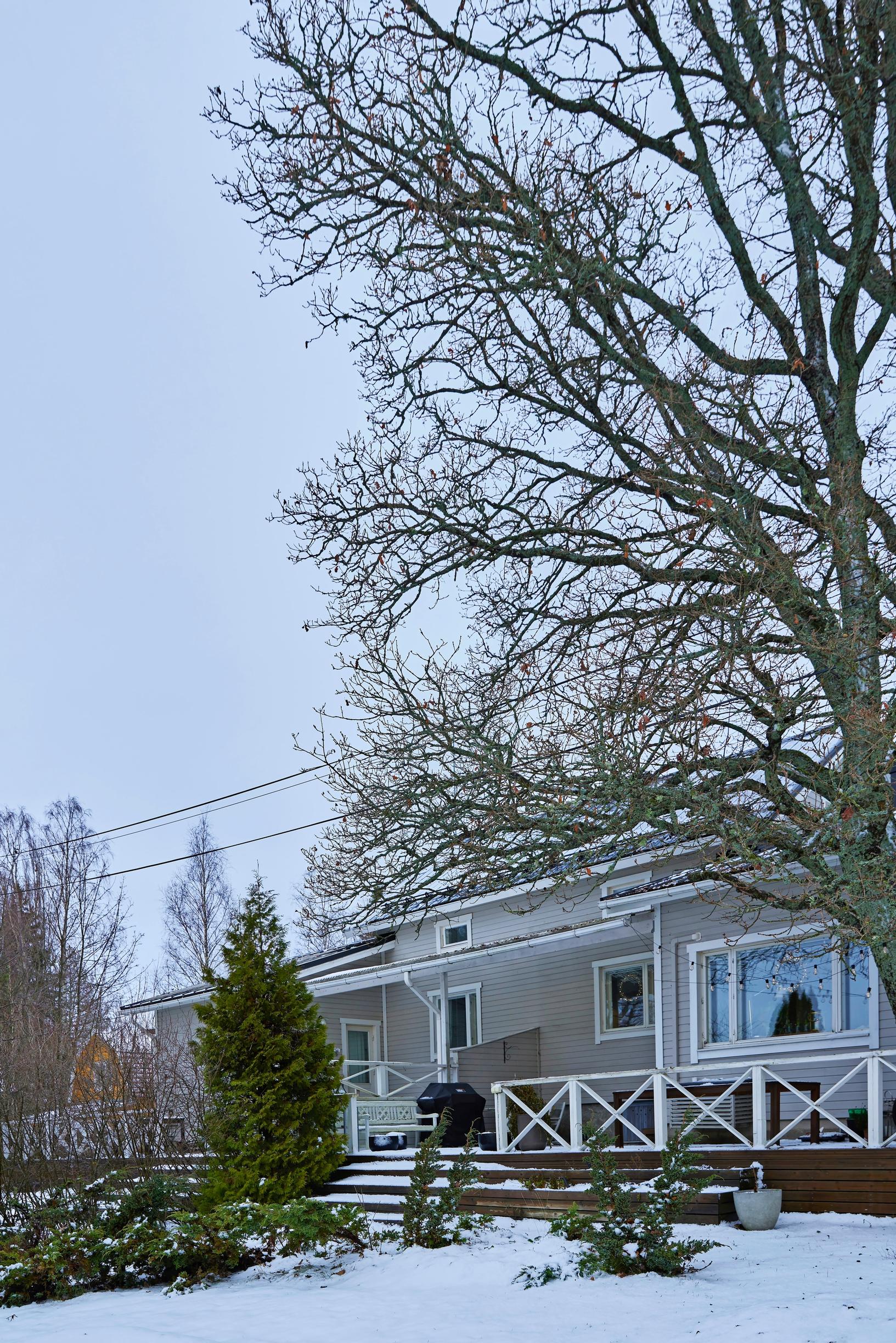 Half of a duplex in a winter landscape
