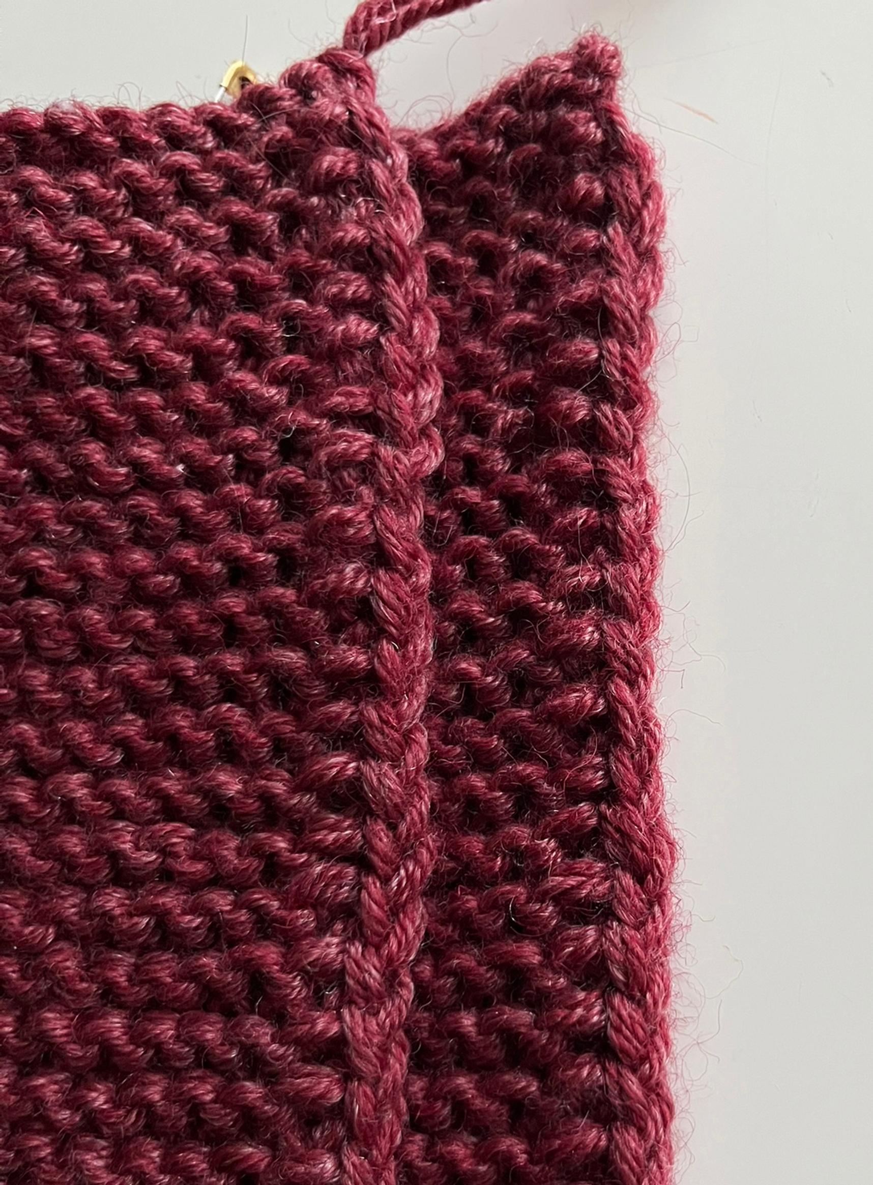 The edge stitches of the knitted slippers