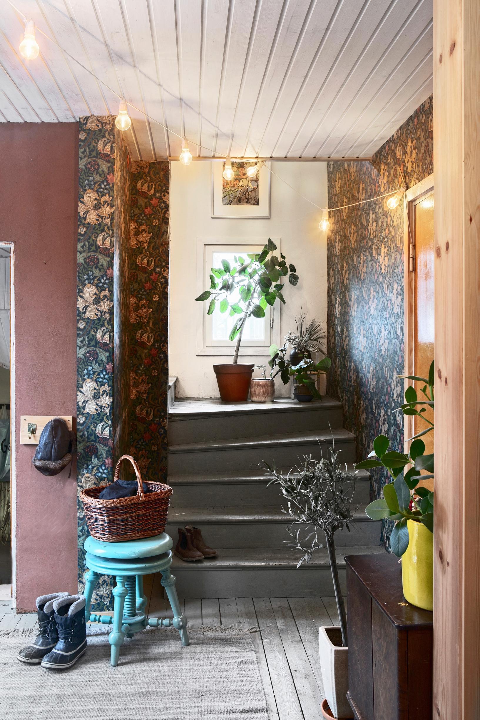 Entryway with floral wallpaper
