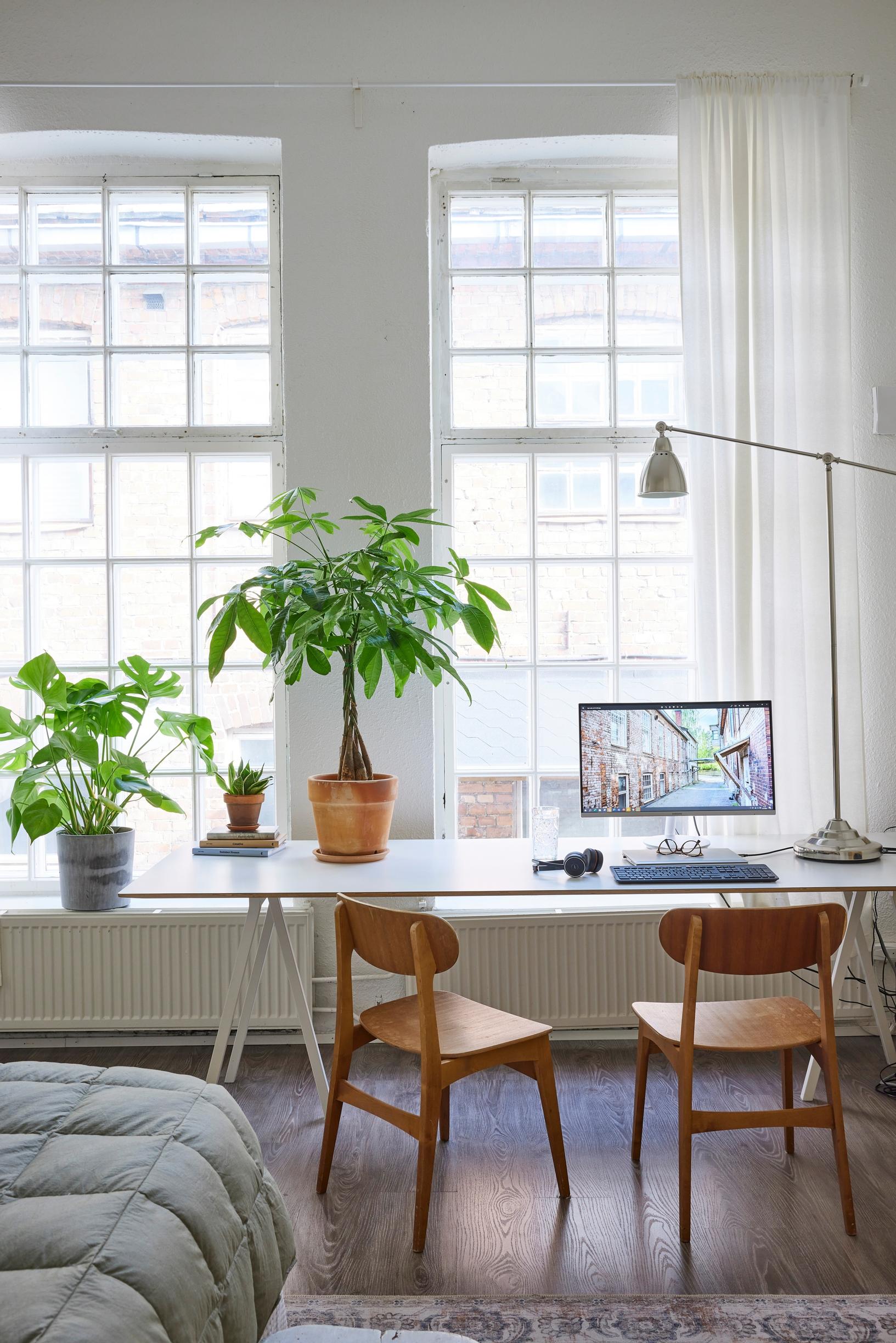 a workspace with wooden chairs