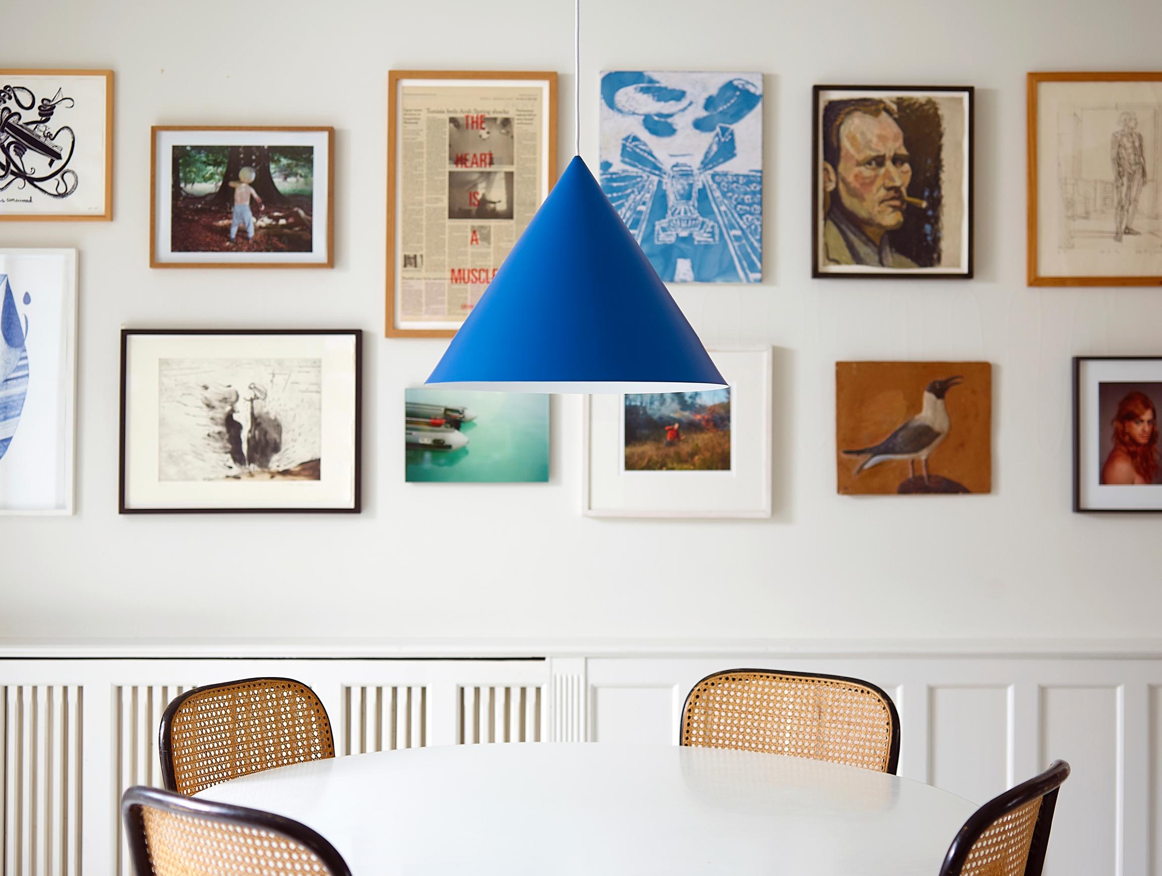 How high to hang art? An art collage in the dining area