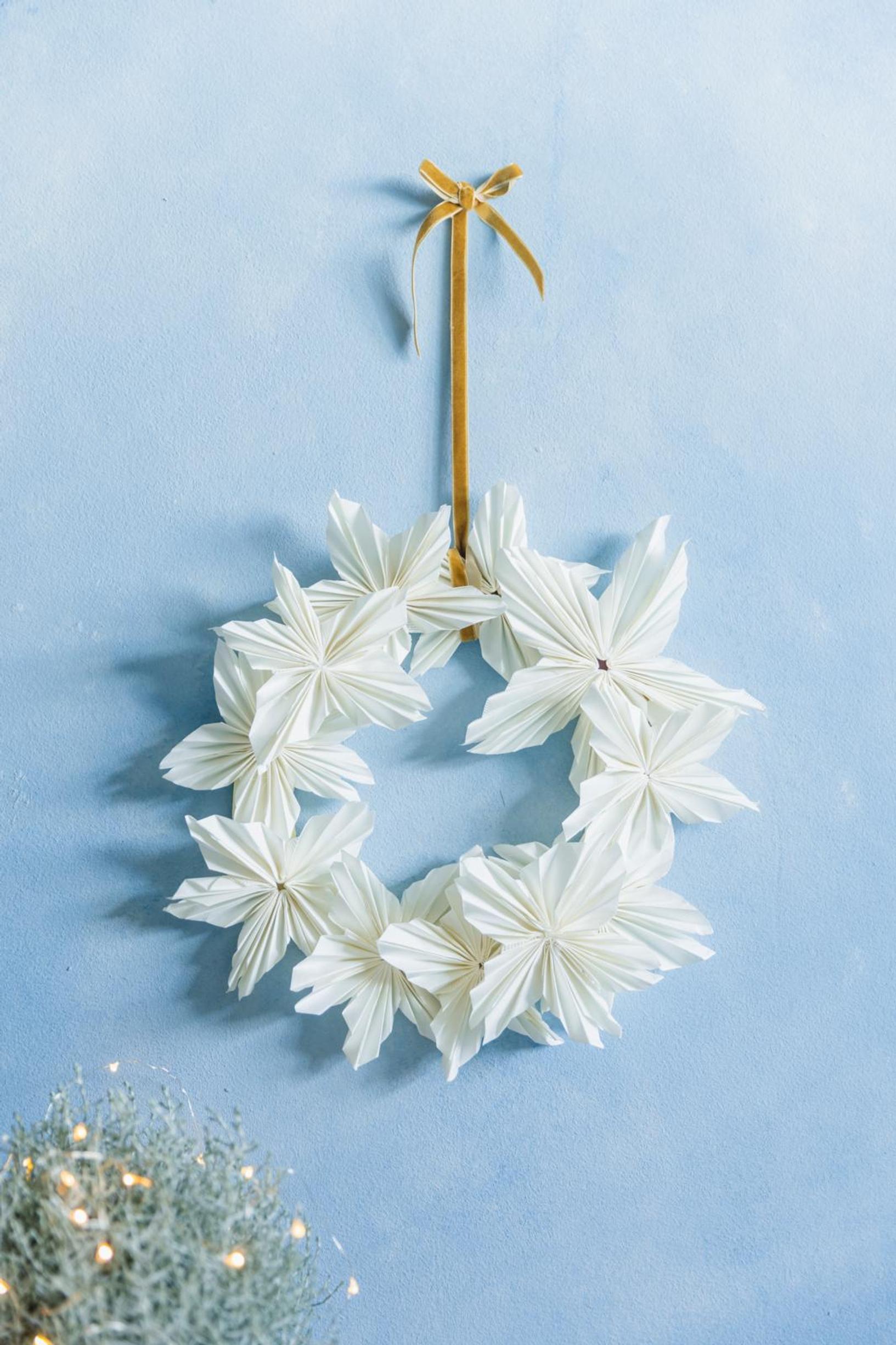 A wreath made of white coffee filter stars.