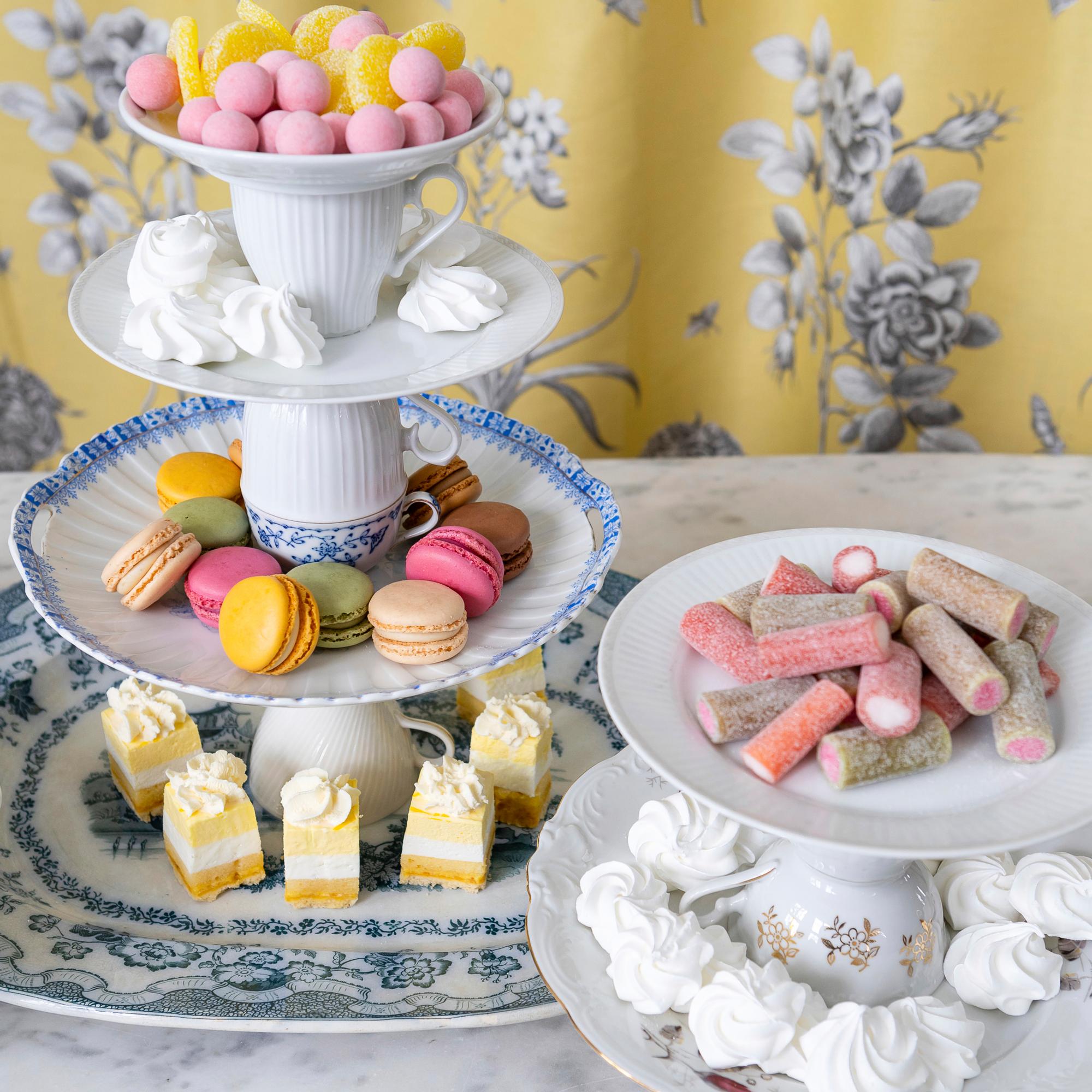 Create a charming tiered tray from mismatched dishes—simply separate with water after the party!