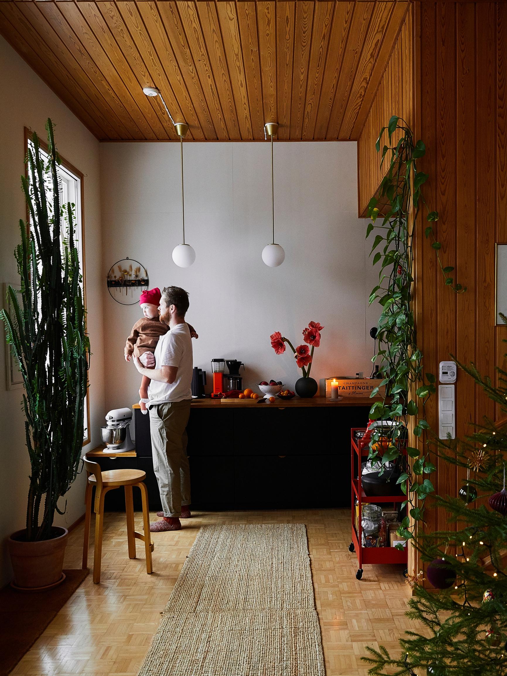 Inside a red duplex where a cook, a baker, and their little girl keep Christmas cozy