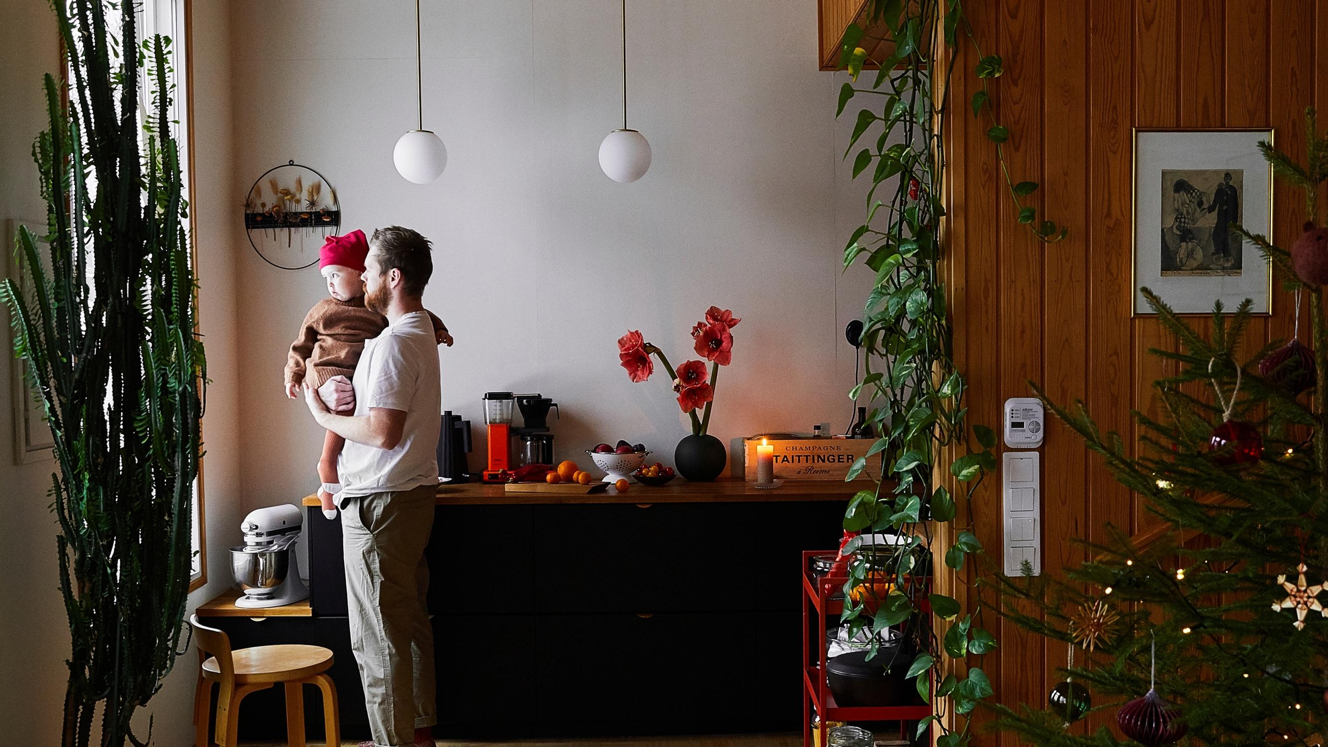 Inside a red duplex where a cook, a baker, and their little girl keep Christmas cozy