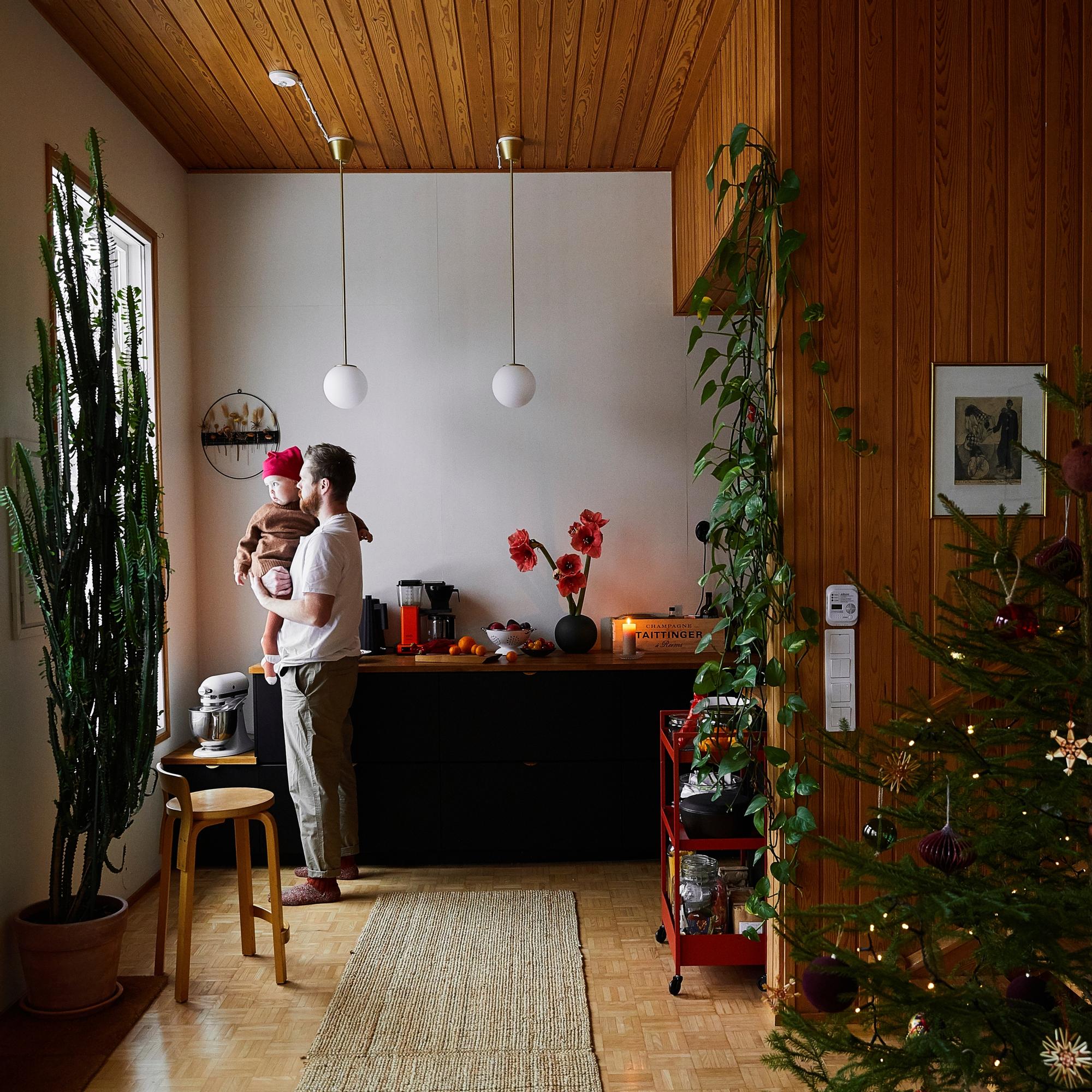 Inside a red duplex where a cook, a baker, and their little girl keep Christmas cozy