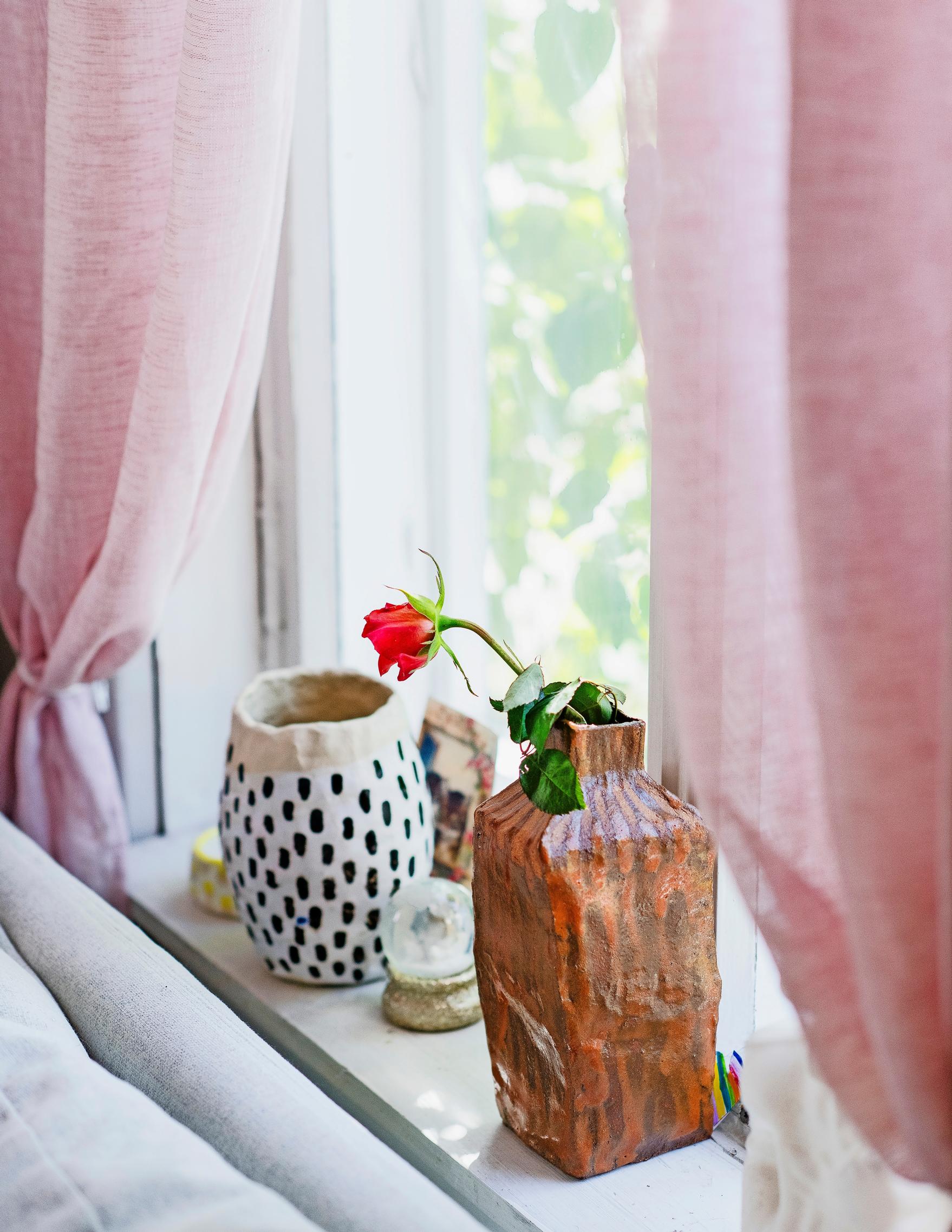 Photo of ceramic pieces on the windowsill.