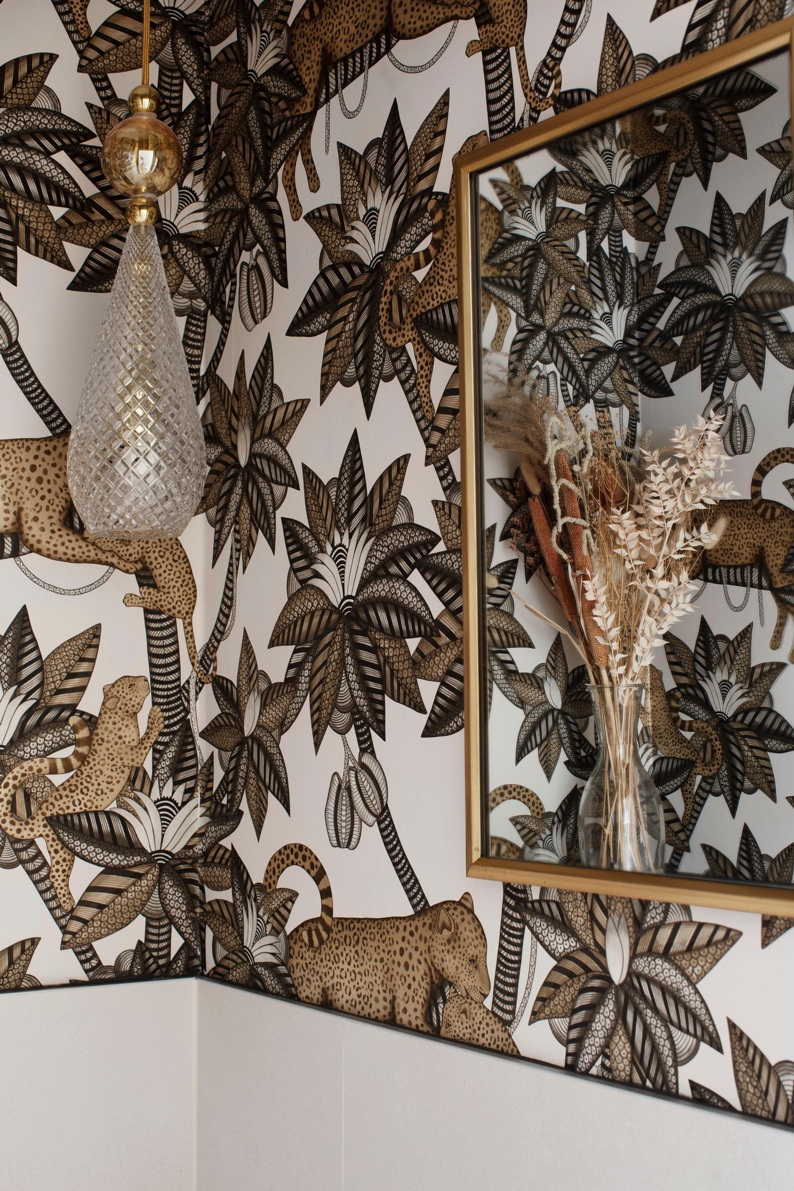 Leopard-themed wallpaper in the children’s bathroom.